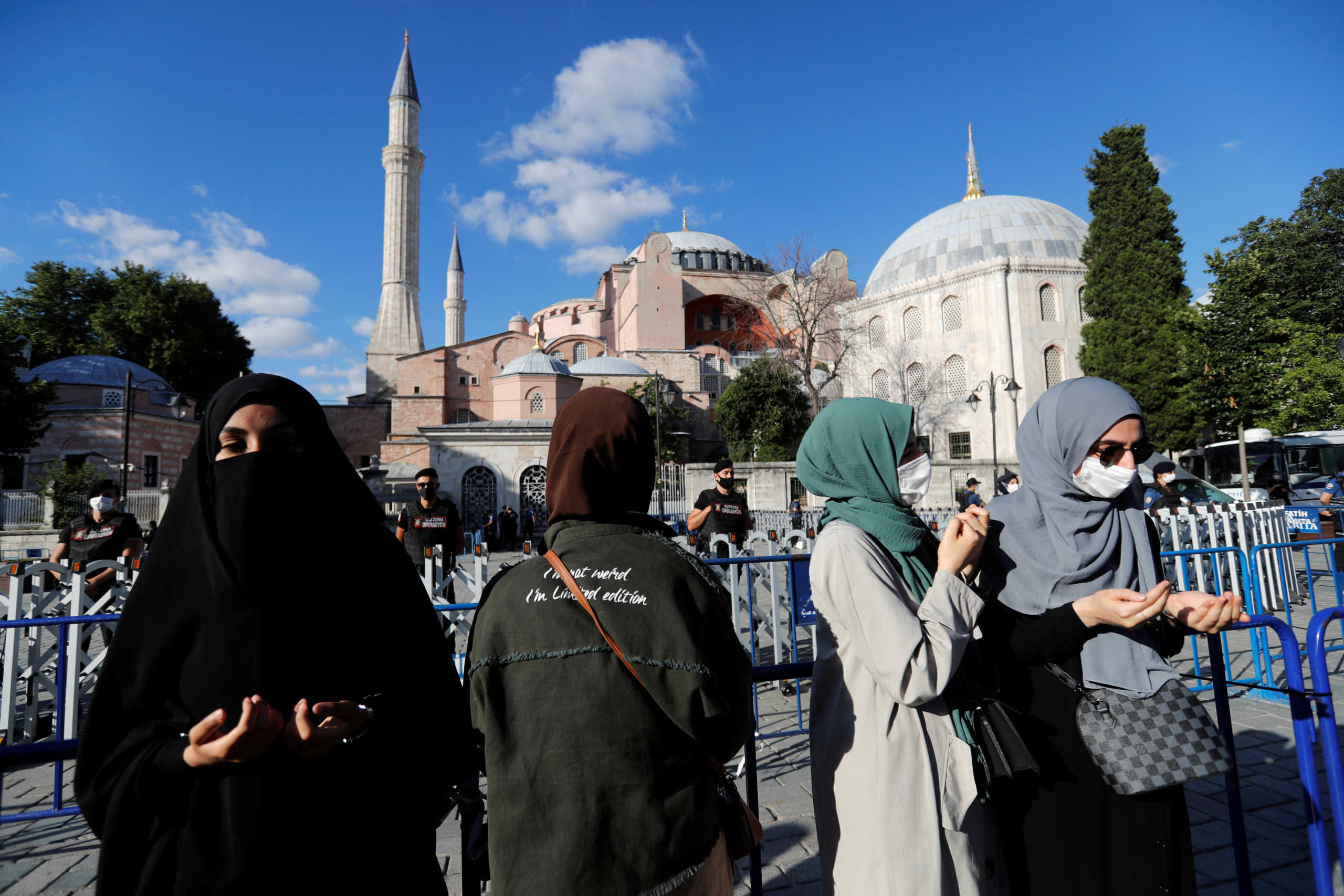 Muslim women pray in front of the Hagia Sophia or Ayasofya, after a court decision that paves the way for it to be converted from a museum back into a mosque, in Istanbul, Turkey, July 10, 2020. REUTERS