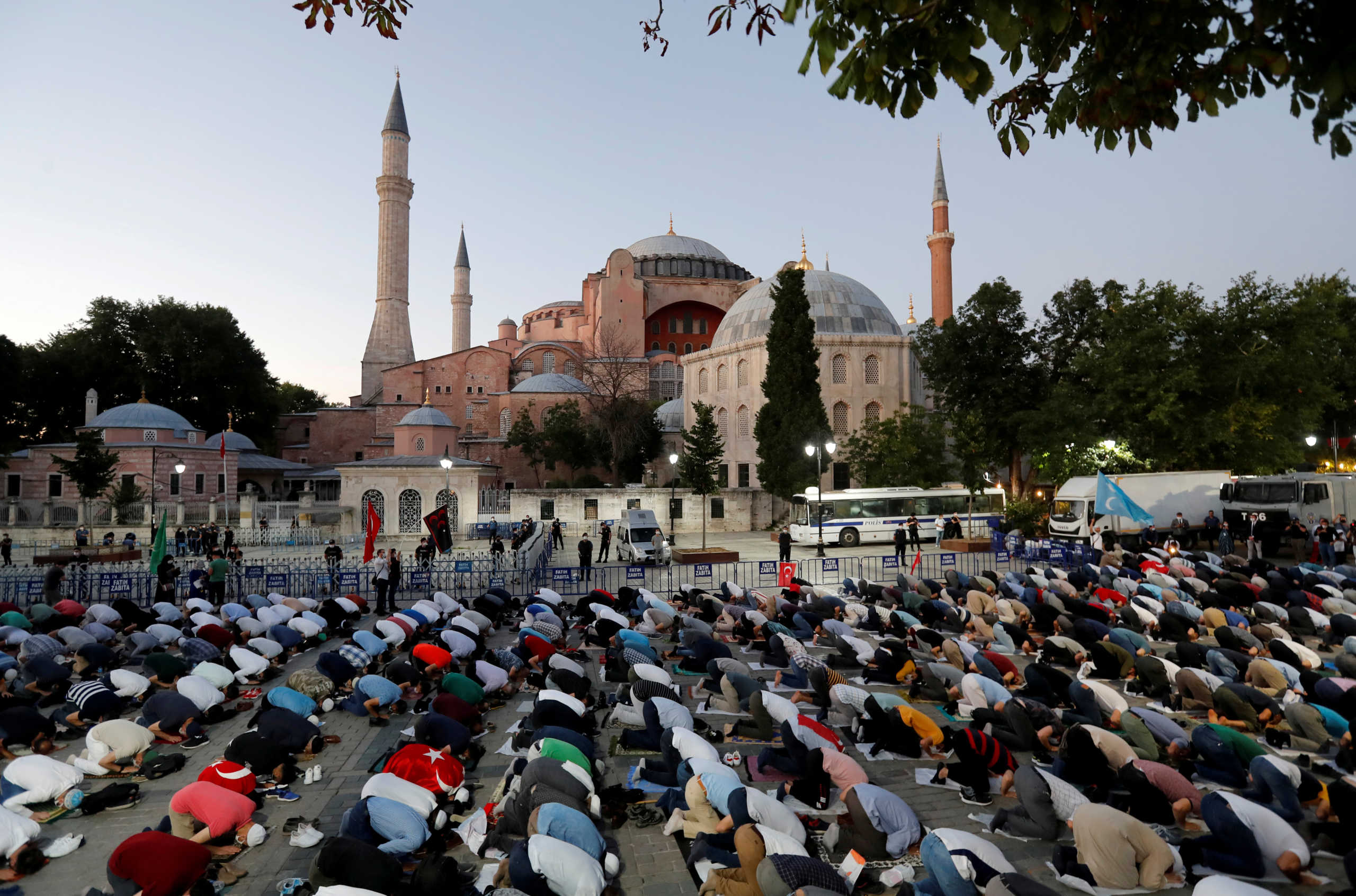 Muslims gather for evening prayers in front of the Hagia Sophia or Ayasofya, after a court decision that paves the way for it to be converted from a museum back into a mosque, in Istanbul, Turkey, July 10, 2020. REUTERS