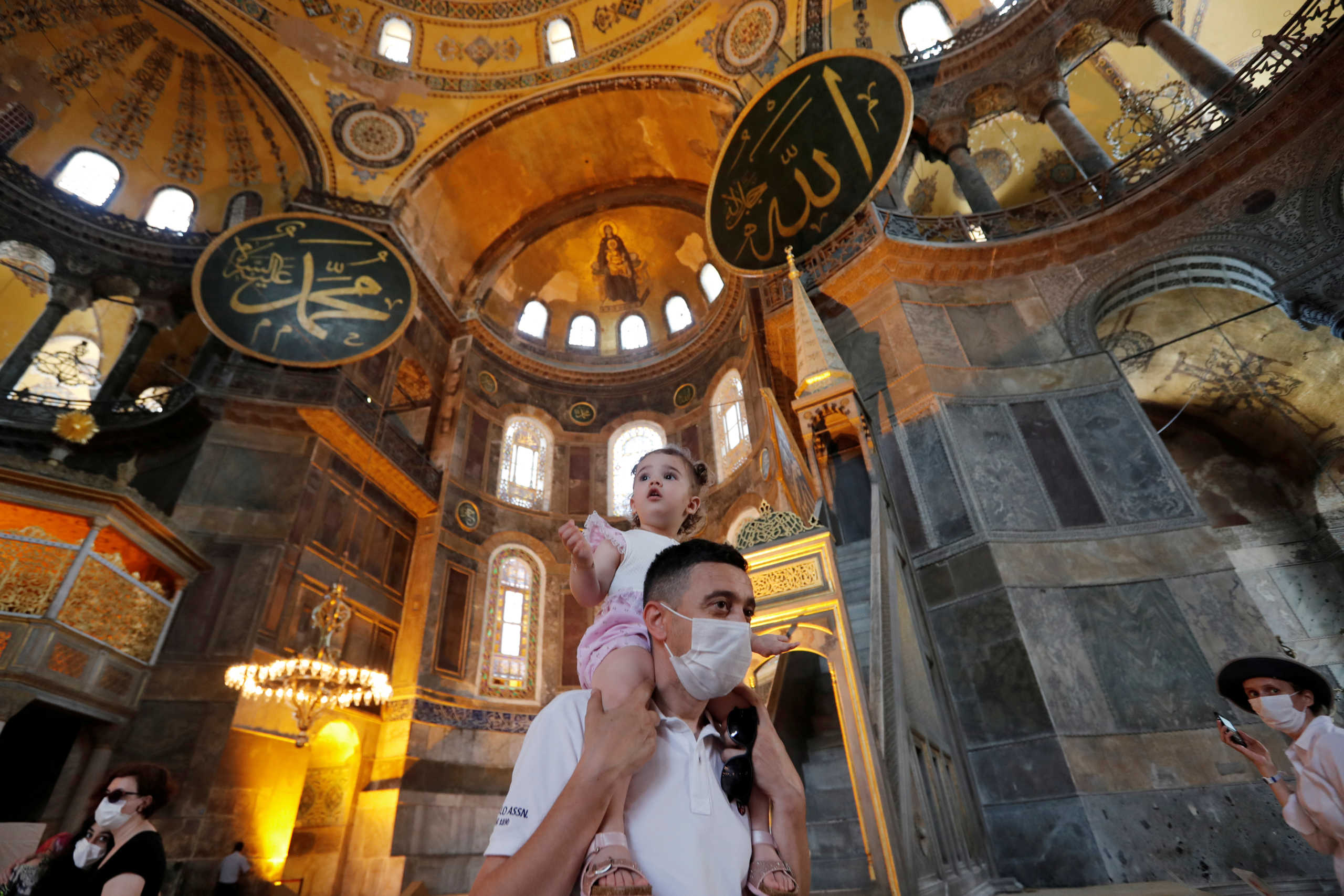 FILE PHOTO: People visit Hagia Sophia or Ayasofya, a UNESCO World Heritage Site, which was a Byzantine cathedral before being converted into a mosque which is currently a museum, in Istanbul, Turkey, June 30, 2020. REUTERS