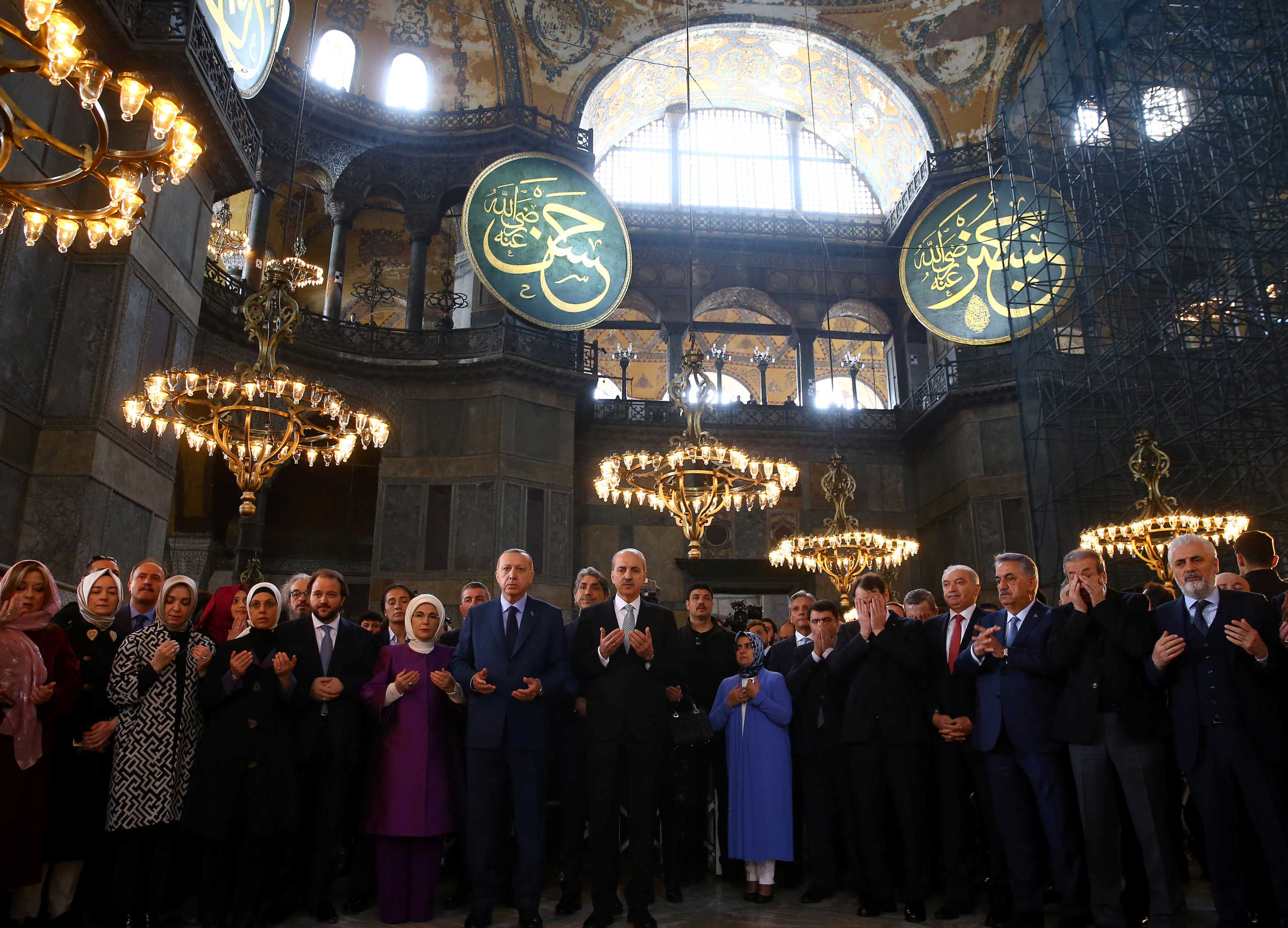 Turkish President Tayyip Erdogan prays during the opening ceremony of the Yeditepe Biennial at the Hagia Sophia or Ayasofya Museum in Istanbul, Turkey, March 31, 2018. Picture taken March 31, 2018. Kayhan Ozer