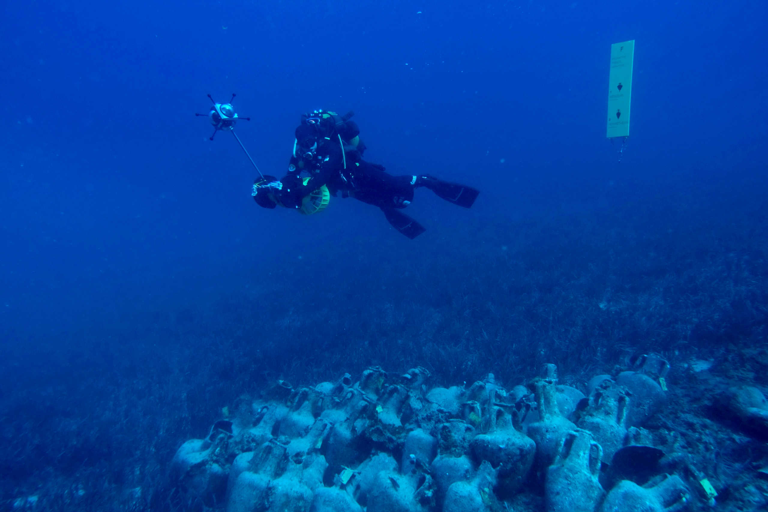 A diver swims near the ancient shipwreck of Peristera islet, off the shores of the island of Alonnisos, Greece, March 14, 2020. Picture taken March 14, 2020. Kostas Katsioulis