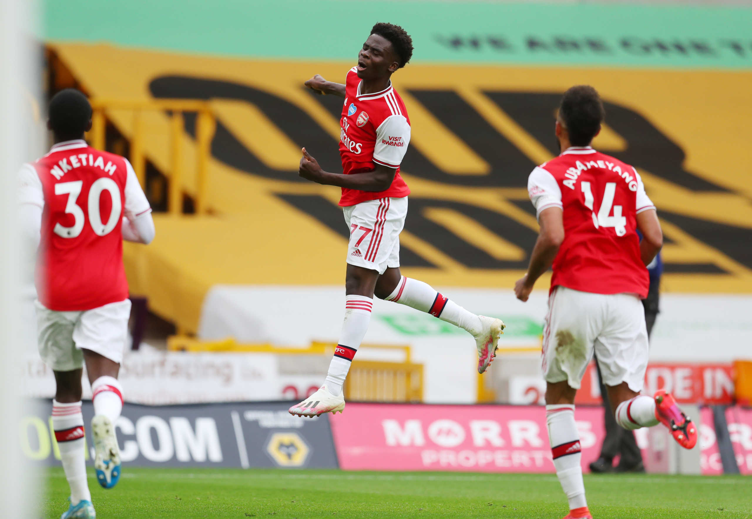 Soccer Football - Premier League - Wolverhampton Wanderers v Arsenal - Molineux Stadium, Wolverhampton, Britain - July 4, 2020 Arsenal's Bukayo Saka celebrates scoring their first goal, as play resumes behind closed doors following the outbreak of the coronavirus disease (COVID-19) Catherine Ivill