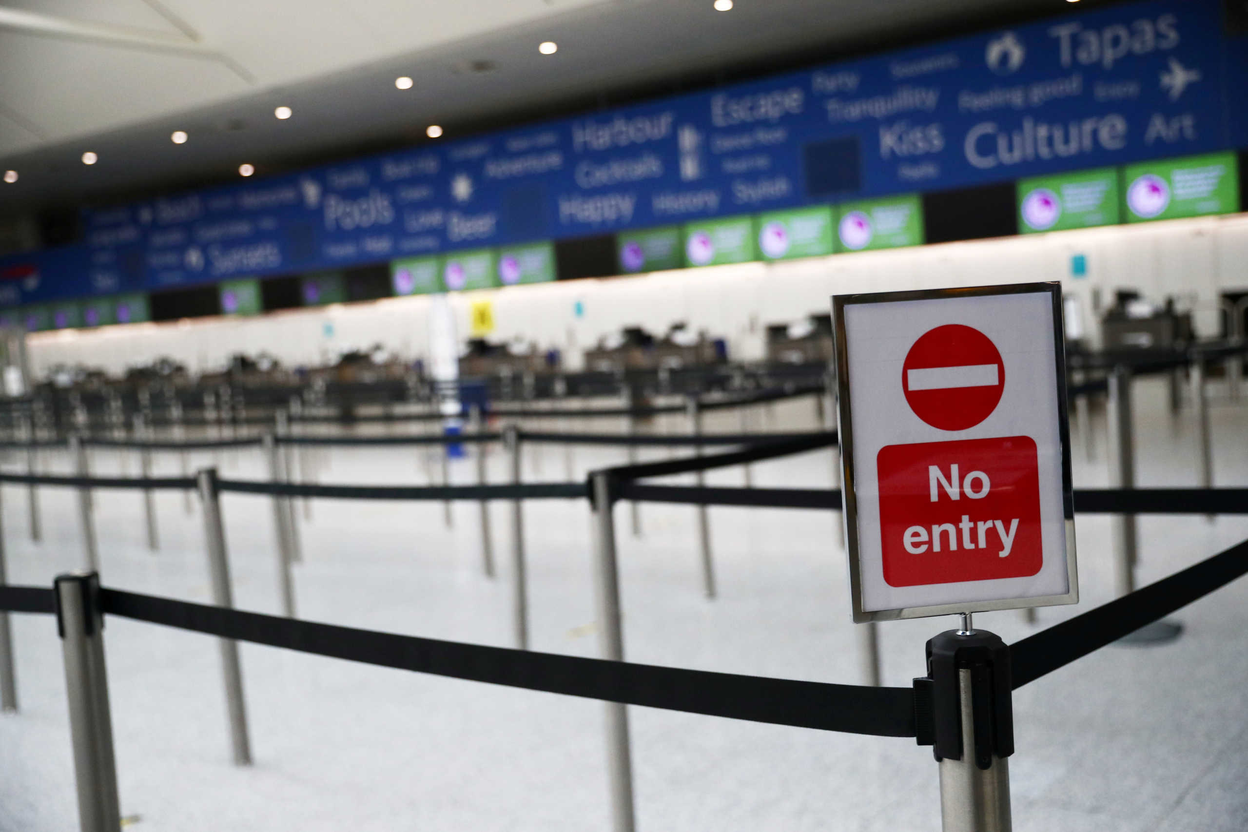 FILE PHOTO: General view of an empty British Airways check in desk area at an empty Gatwick airport, as the spread of the coronavirus disease (COVID-19) continues, Gatwick, Britain, May 5, 2020. REUTERS