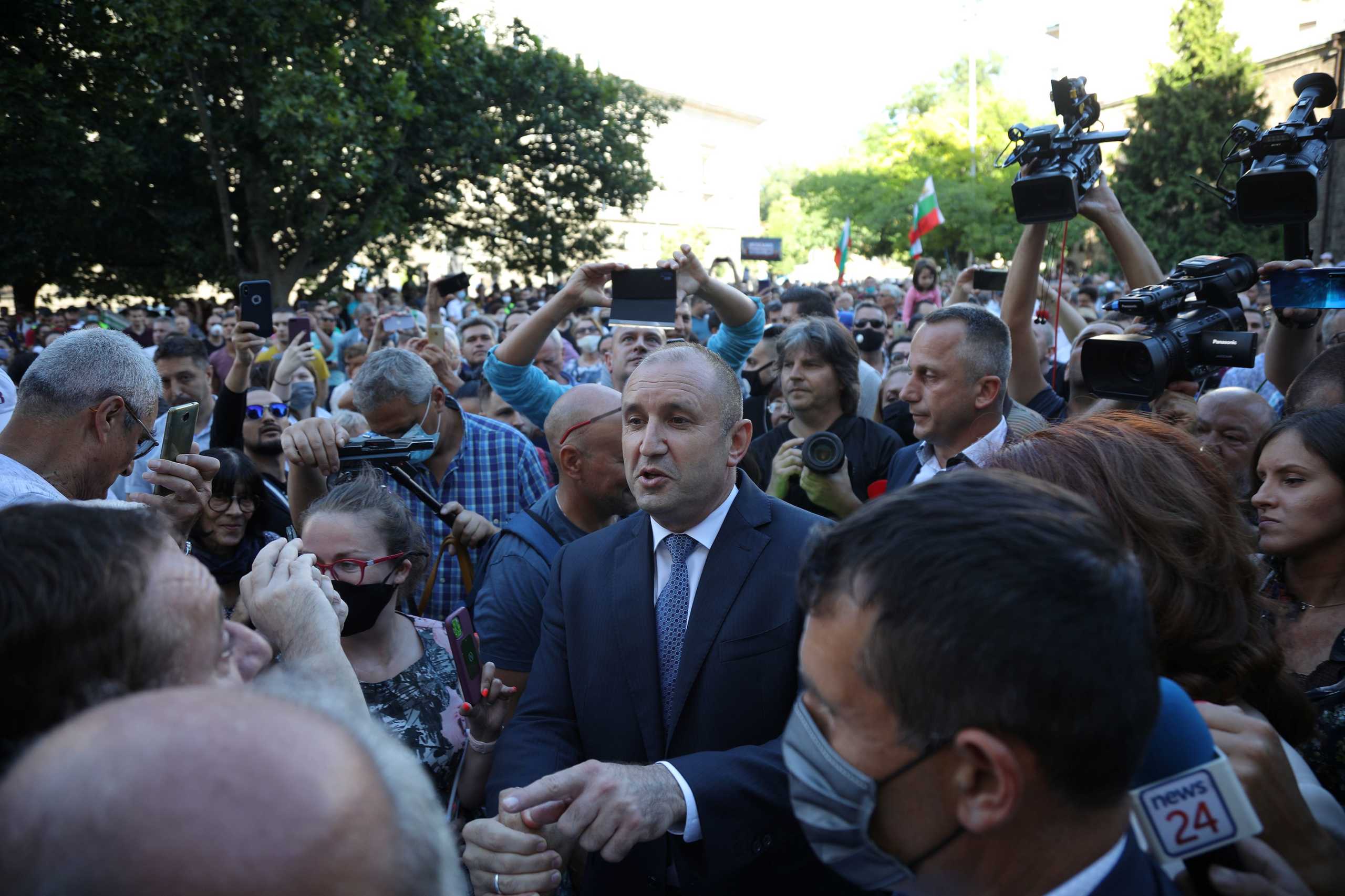 Bulgarian President Rumen Radev (C) talks to supporters at a demonstration after prosecutors raided Bulgarian president's offices as part of investigations, in Sofia, Bulgaria, July 9, 2020. REUTERS