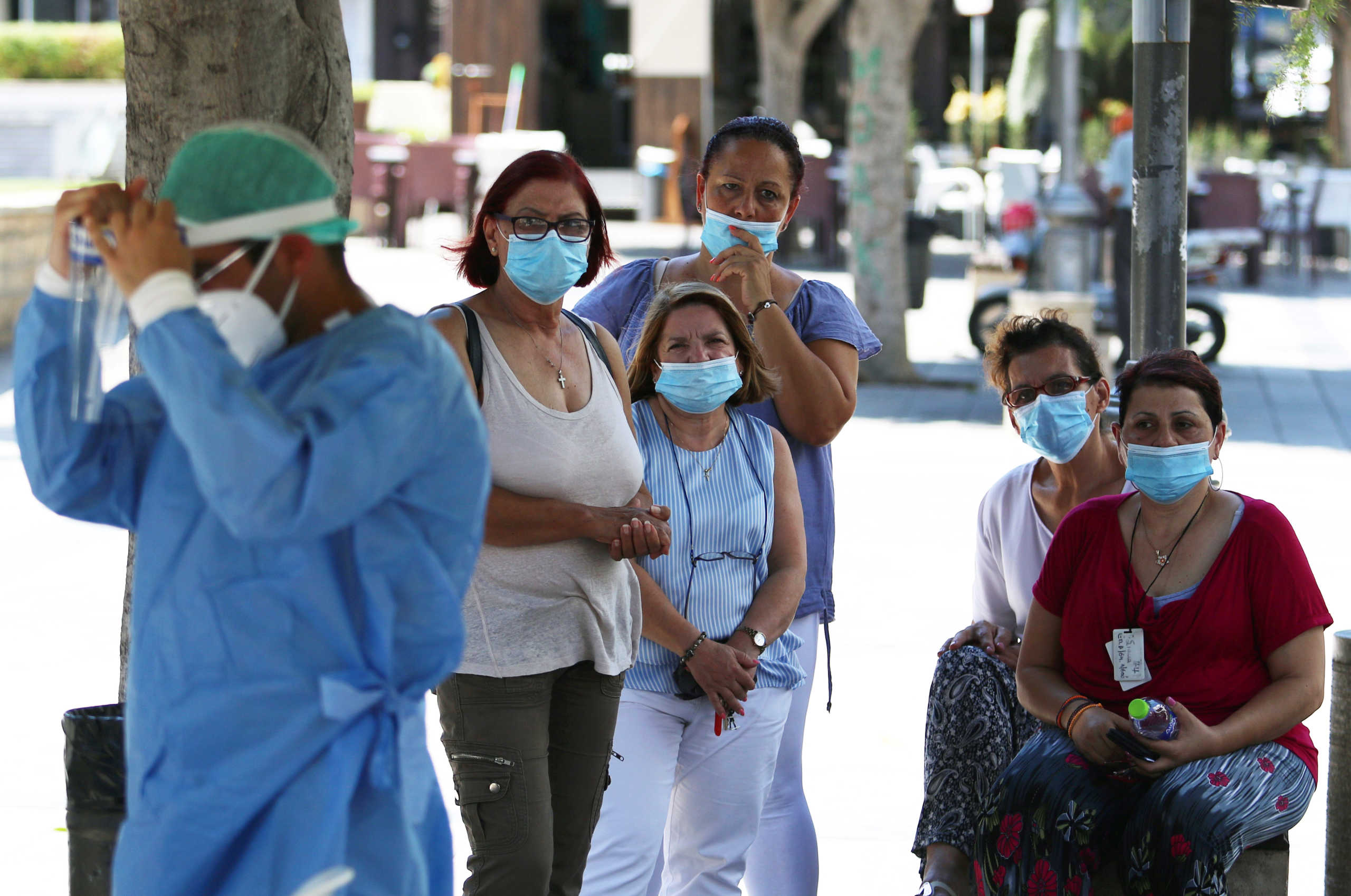 People wait in line as healthcare workers take samples for the coronavirus disease (COVID-19) test in Limassol, Cyprus, July 29, 2020. REUTERS