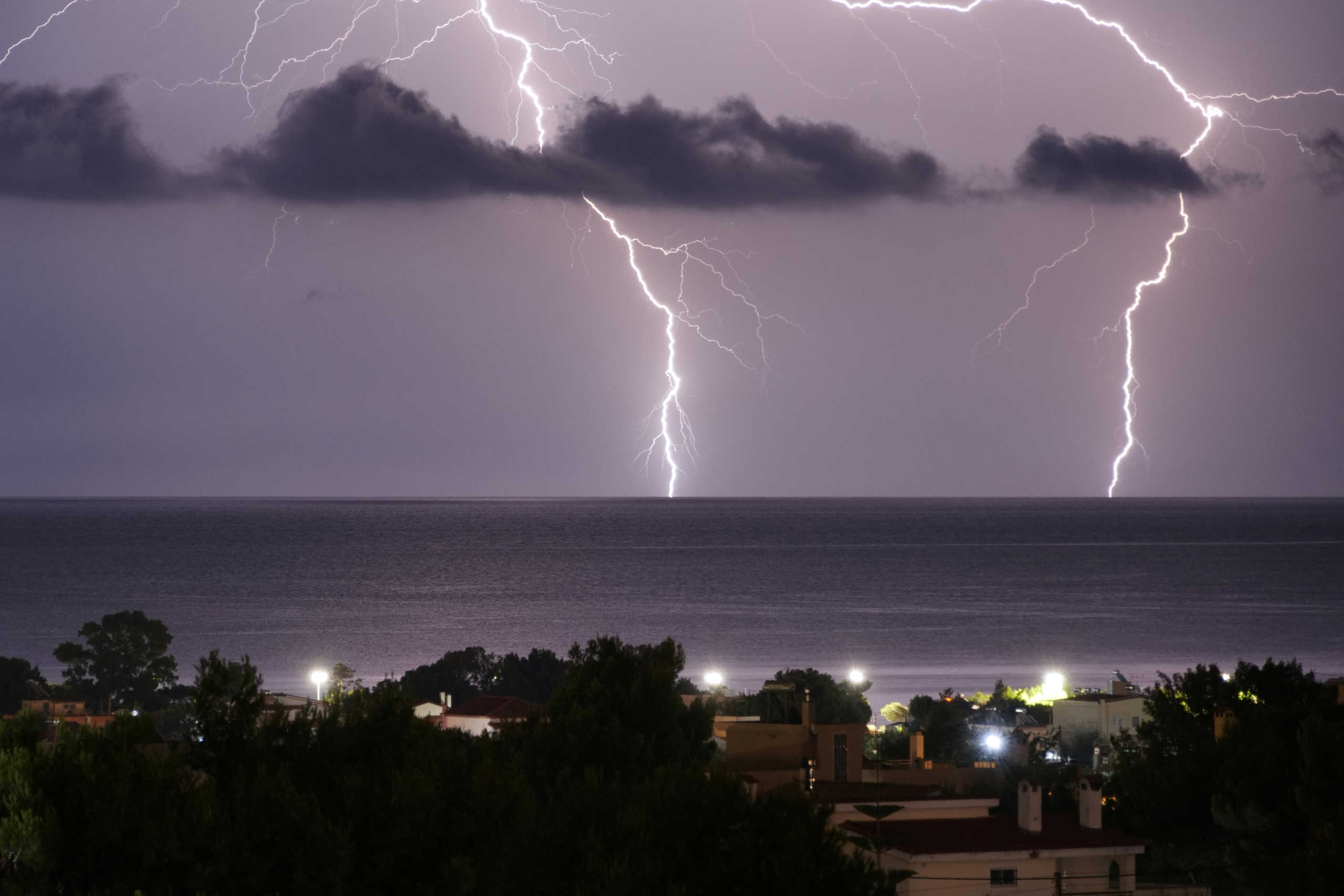 Lightnings strike in the sea off the shore of Artemida, Greece, Greece, June 23, 2020. REUTERS