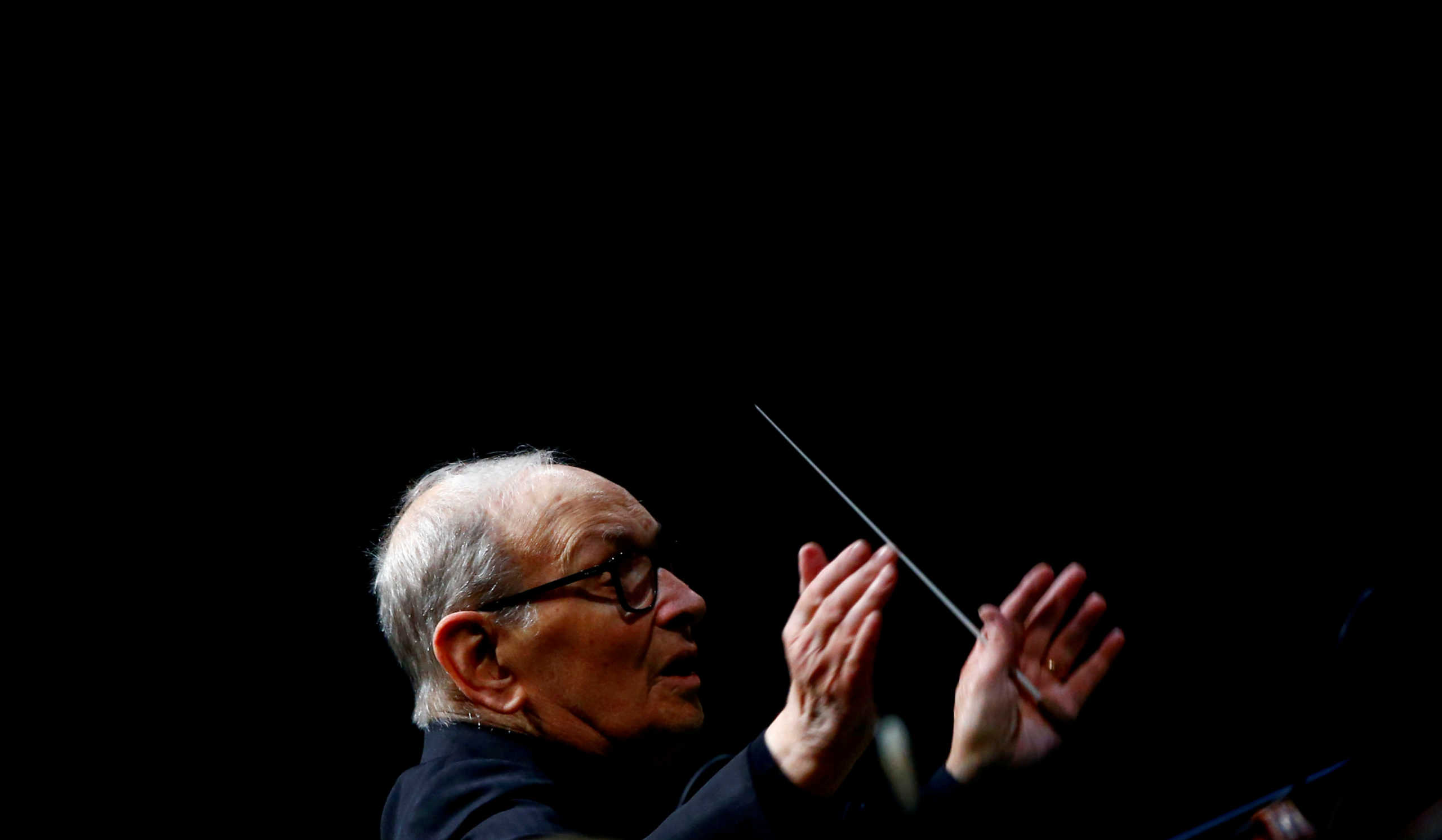 FILE PHOTO: Italian composer Ennio Morricone conducts a concert in Berlin, Germany, January 21, 2019.    REUTERS
