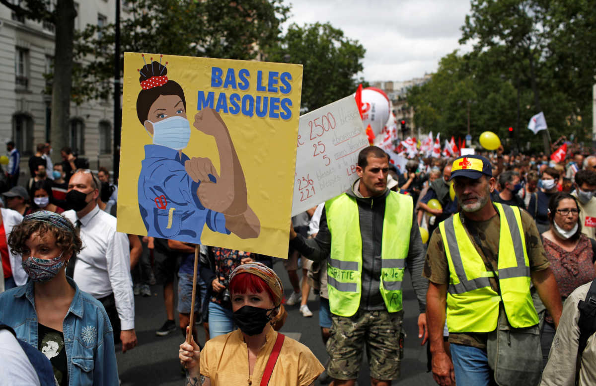 French health workers attend a demonstration on the Bastille Day in Paris, as part of a nationwide day of actions to urge the French government to improve wages and invest in public hospitals, in the wake of the coronavirus disease (COVID-19) crisis, in France, July 14, 2020. REUTERS