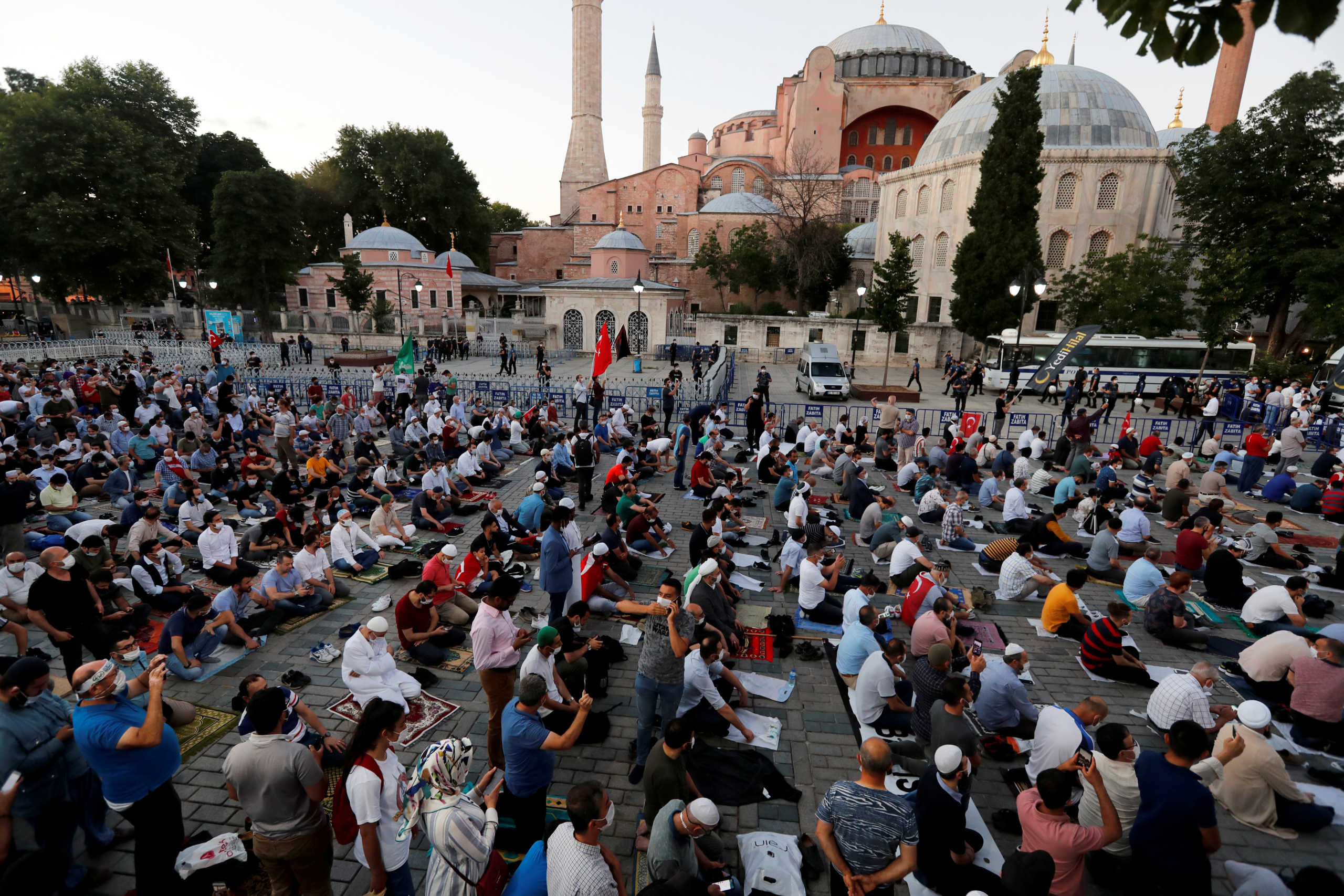 Muslims gather for evening prayers in front of the Hagia Sophia or Ayasofya, after a court decision that paves the way for it to be converted from a museum back into a mosque, in Istanbul, Turkey, July 10, 2020. REUTERS