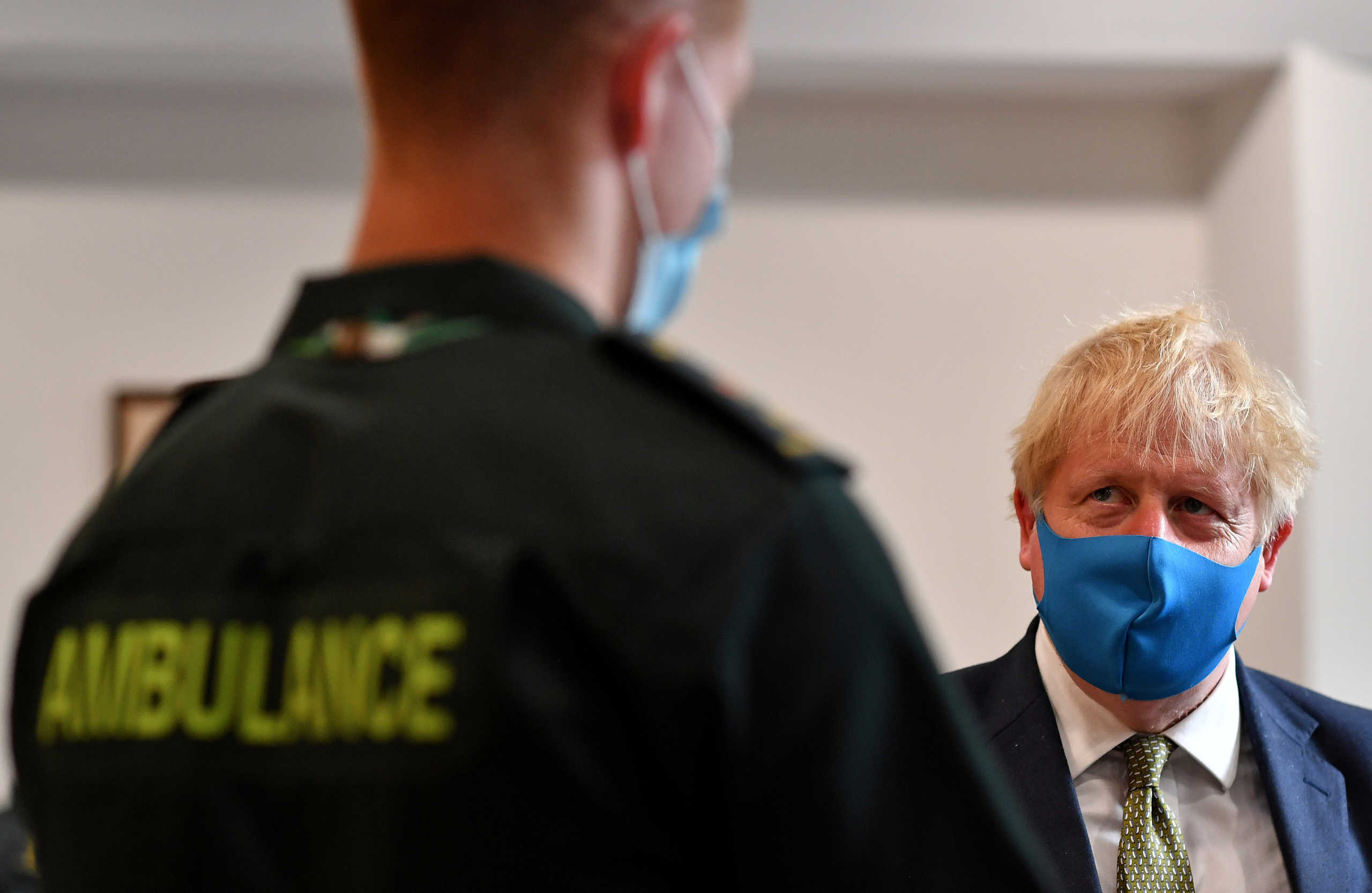 Britain's Prime Minister Boris Johnson talks with a paramedic as he visits headquarters of the London Ambulance Service NHS Trust, amid the spread of the coronavirus disease (COVID-19), in London, Britain July 13, 2020. Ben Stansall