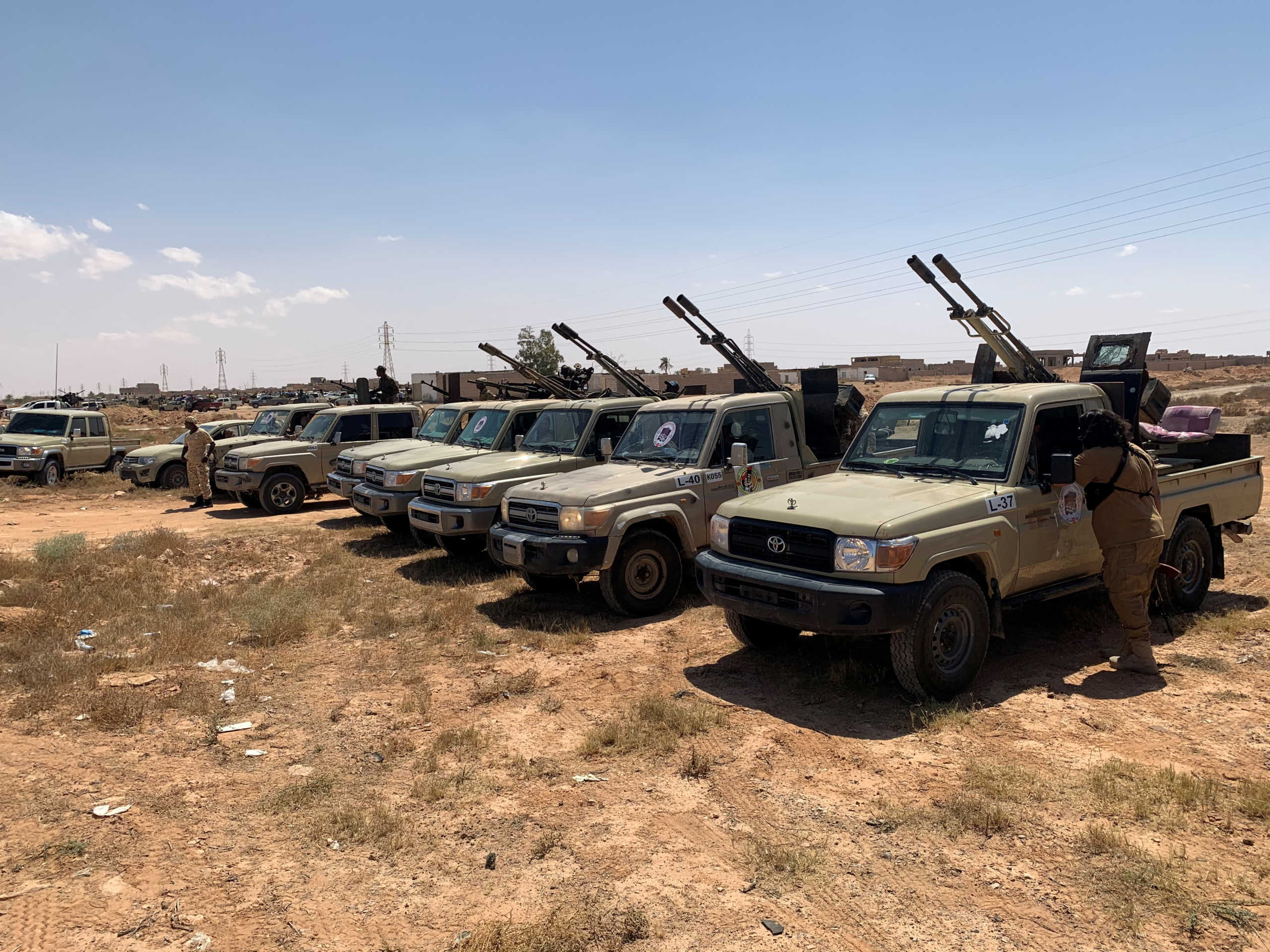 Troops loyal to Libya's internationally recognized government are seen in military vehicles as they prepare before heading to Sirte, on the outskirts of Misrata, Libya, July 18, 2020. REUTERS