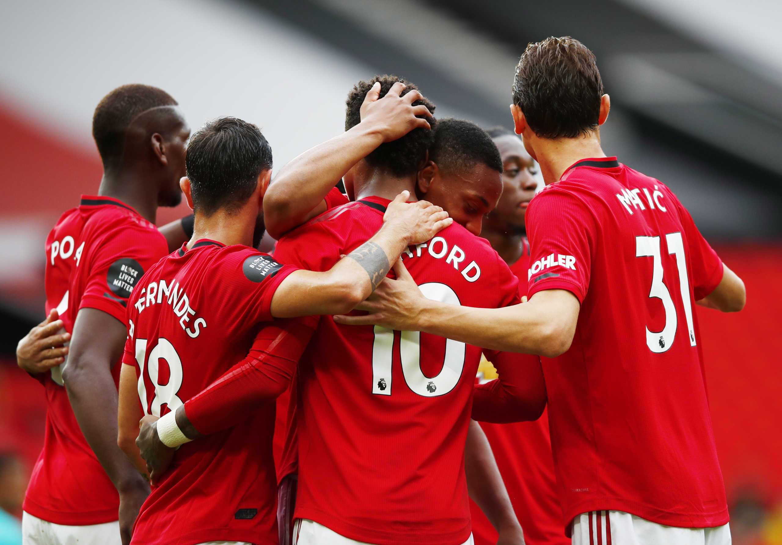 Soccer Football - Premier League - Manchester United v AFC Bournemouth - Old Trafford, Manchester, Britain - July 4, 2020 Manchester United's Marcus Rashford celebrates scoring their second goal with teammates, as play resumes behind closed doors following the outbreak of the coronavirus disease (COVID-19) Clive Brunskill