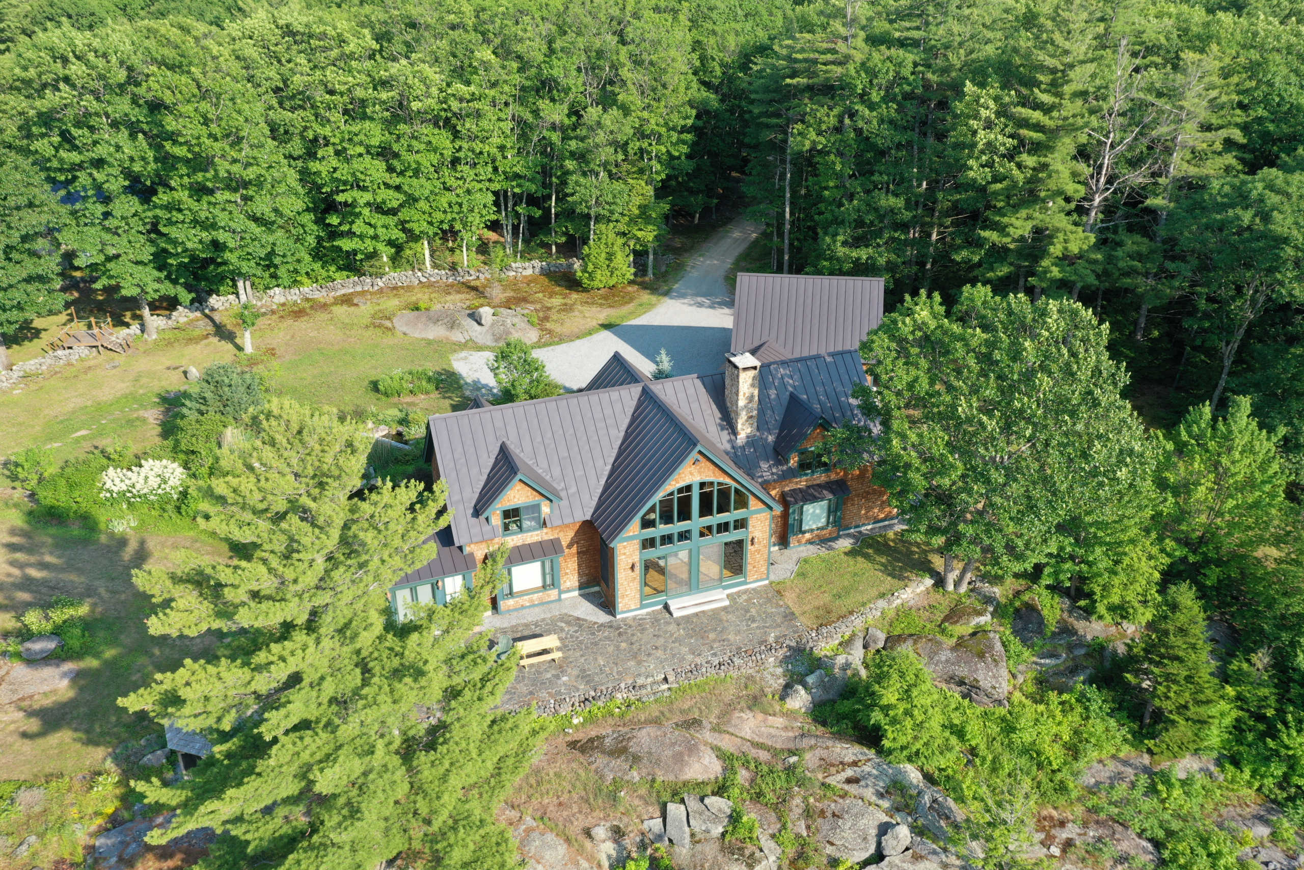 The property where Ghislaine Maxwell, former associate of late disgraced financier Jeffrey Epstein, was arrested by the Federal Bureau of Investigation (FBI) is seen in an aerial photograph in Bradford, New Hampshire, U.S. July 2, 2020.   REUTERS