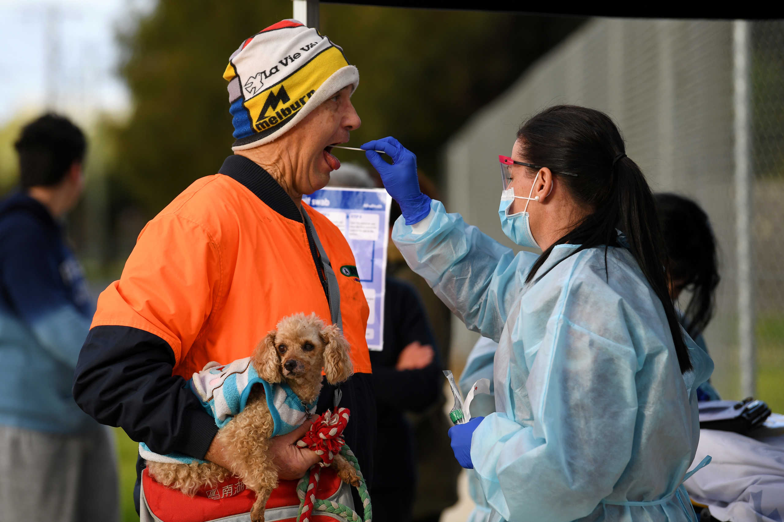 A medical professional administers a test to a member of the public at a pop-up coronavirus disease (COVID-19) testing facility, as the state of Victoria experiences a spike in cases, in Melbourne, Australia, June 26, 2020.  AAP Image
