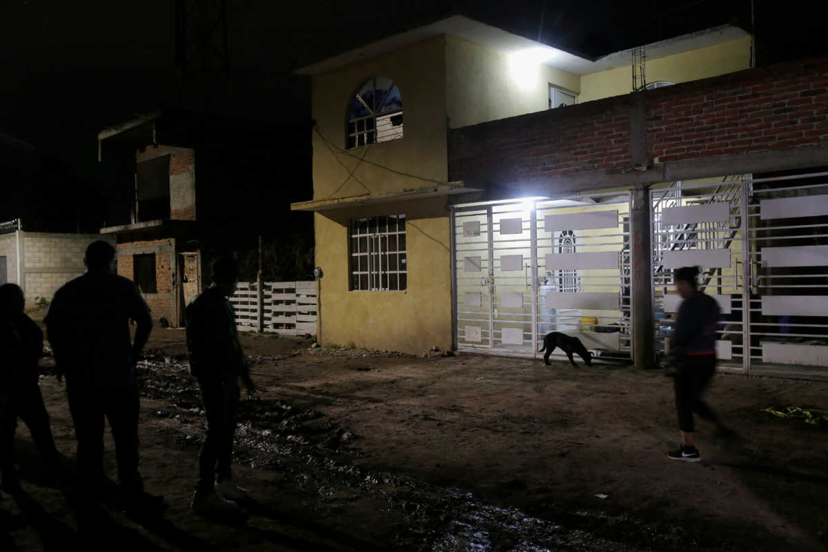 Members of the media stand outside a drug rehabilitation facility where assailants killed several people according to Guanajuato state police, in Irapuato, Mexico July 1, 2020. REUTERS