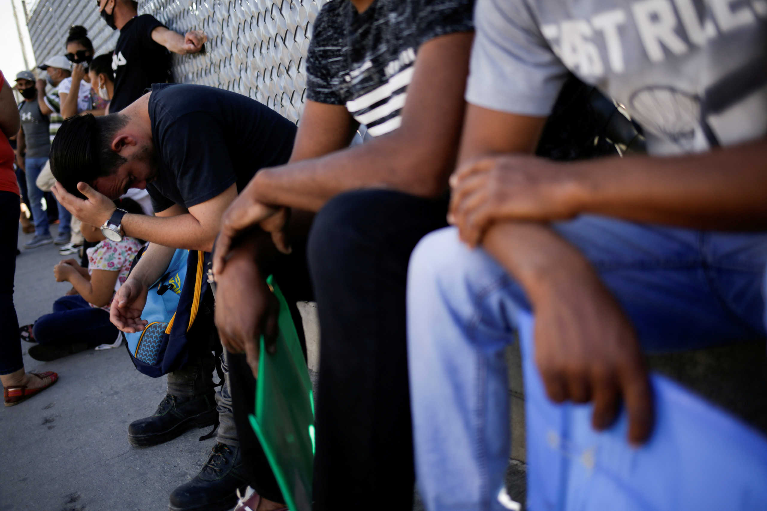 Migrants in the "Remain in Mexico" program queue outside the premises of the National Migration Institute (INM) to renew their permission to stay legally in Mexico to wait for their immigration hearing in the U.S., in Ciudad Juarez, Mexico July 8, 2020. REUTERS