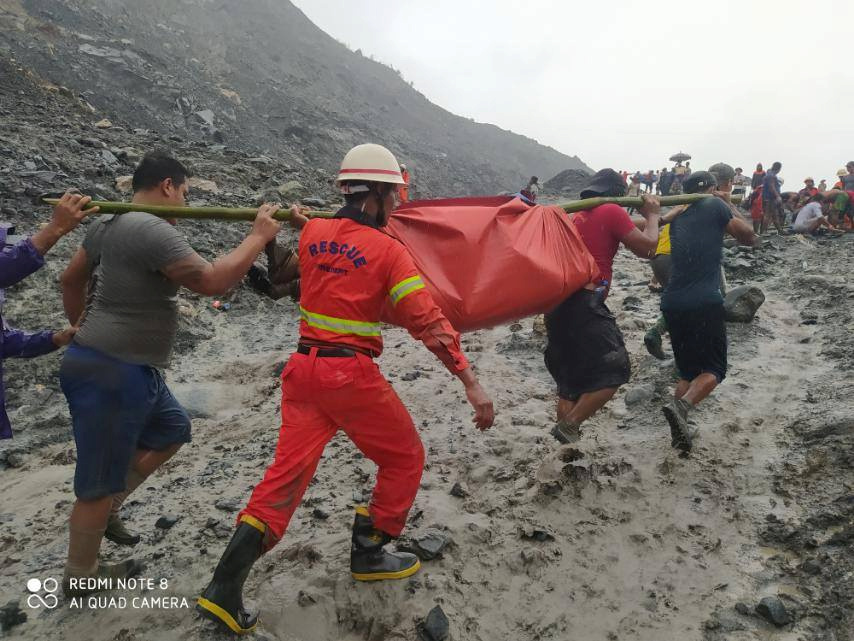 SENSITIVE MATERIAL. THIS IMAGE MAY OFFEND OR DISTURB People carry a dead body following a landslide at a mining site in Hpakant, Kachin State City, Myanmar July 2, 2020, in this picture obtained from social media.  MYANMAR FIRE SERVICES DEPARTMENT