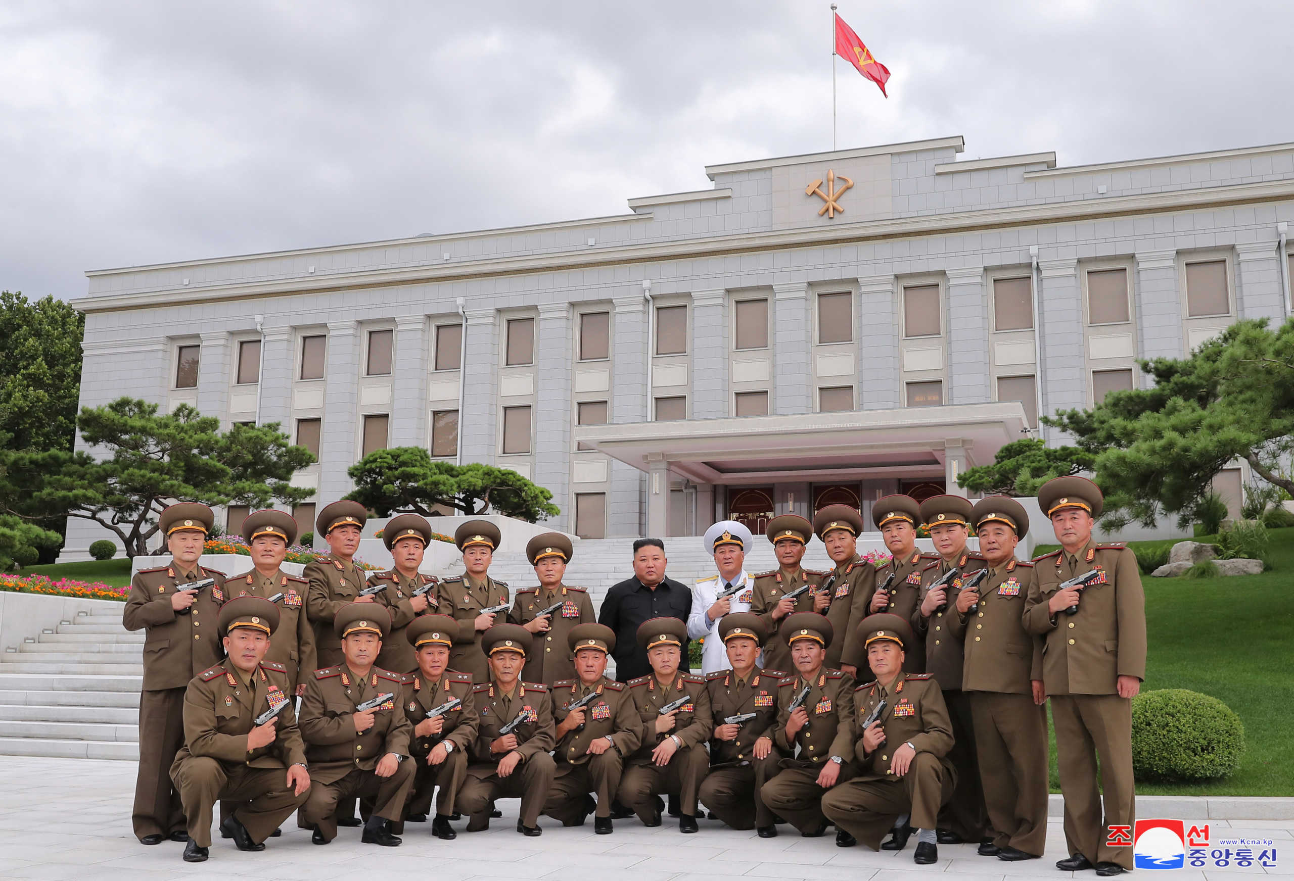 North Korean leader Kim Jong Un poses for a photograph after conferring "Paektusan" commemorative pistols to leading commanding officers of the armed forces on the 67th anniversary of the "Day of Victory in the Great Fatherland Liberation War", which marks the signing of the Korean War armistice, in this undated photo released on July 27, 2020 by North Korean Central News Agency (KCNA) in Pyongyang. KCNA via REUTERS ATTENTION EDITORS - THIS IMAGE WAS PROVIDED BY A THIRD PARTY. REUTERS IS UNABLE TO INDEPENDENTLY VERIFY THIS IMAGE. NO THIRD PARTY SALES. SOUTH KOREA OUT. NO COMMERCIAL OR EDITORIAL SALES IN SOUTH KOREA.