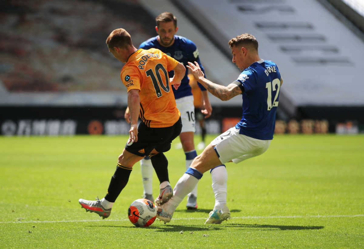 Soccer Football - Premier League - Wolverhampton Wanderers v Everton - Molineux Stadium, Wolverhampton, Britain - July 12, 2020 Everton's Lucas Digne fouls Wolverhampton Wanderers' Daniel Podence and a penalty is awarded to Wolverhampton, as play resumes behind closed doors following the outbreak of the coronavirus disease (COVID-19) REUTERS