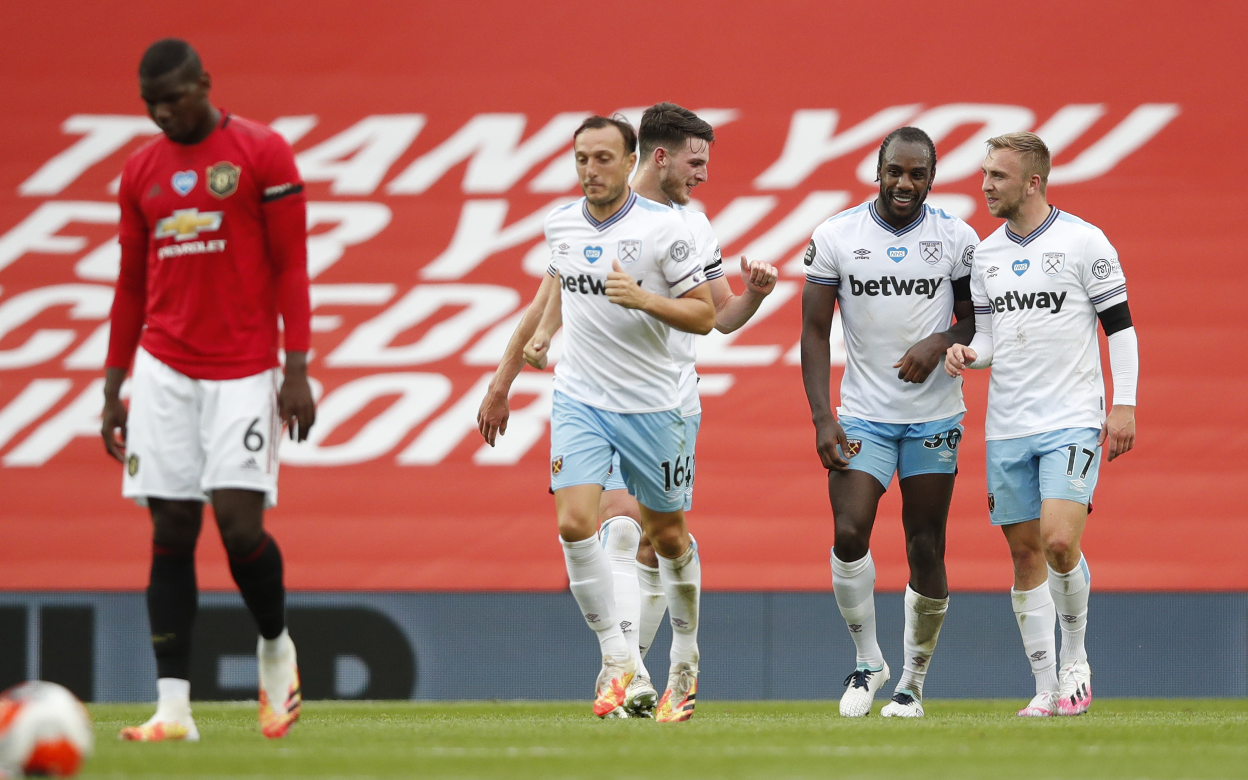 Soccer Football - Premier League - Manchester United v West Ham United - Old Trafford, Manchester, Britain - July 22, 2020 West Ham United's Michail Antonio celebrates scoring their first goal with teammates, as play resumes behind closed doors following the outbreak of the coronavirus disease (COVID-19) Pool via REUTERS