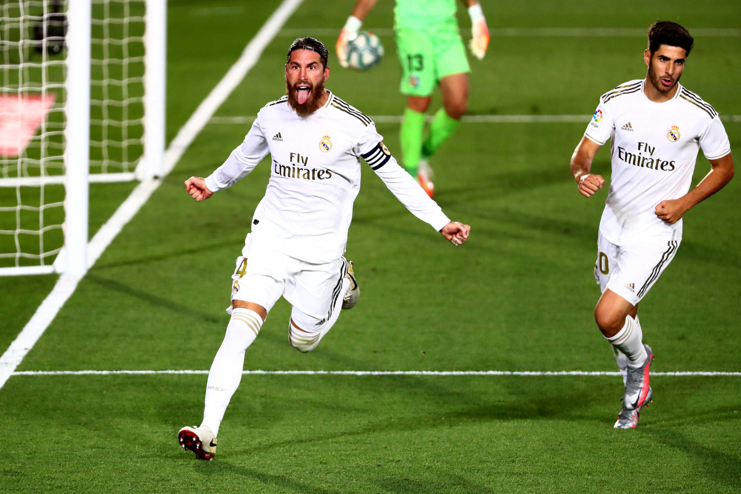 Soccer Football - La Liga Santander - Real Madrid v Getafe - Alfredo Di Stefano Stadium, Madrid, Spain - July 2, 2020   Real Madrid's Sergio Ramos celebrates scoring their first goal, as play resumes behind closed doors following the outbreak of the coronavirus disease (COVID-19)   REUTERS