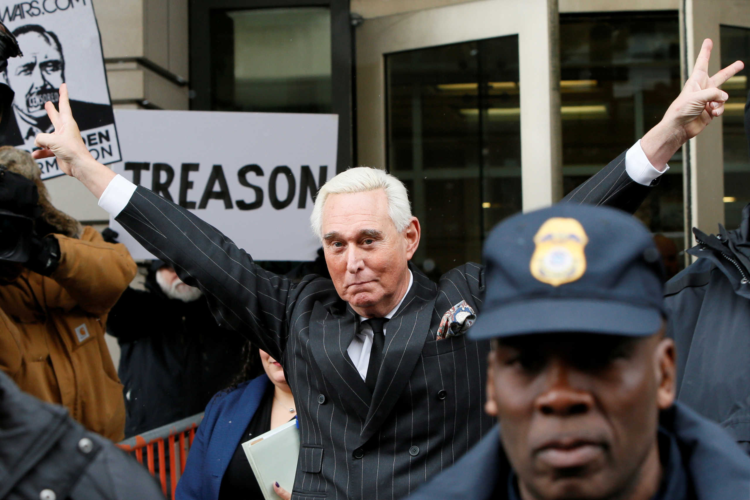 FILE PHOTO: Roger Stone, longtime political ally of U.S. President Donald Trump, flashes a victory gesture as he departs following a status conference in the criminal case against him brought by Special Counsel Robert Mueller at U.S. District Court in Washington, U.S., February 1, 2019. REUTERS