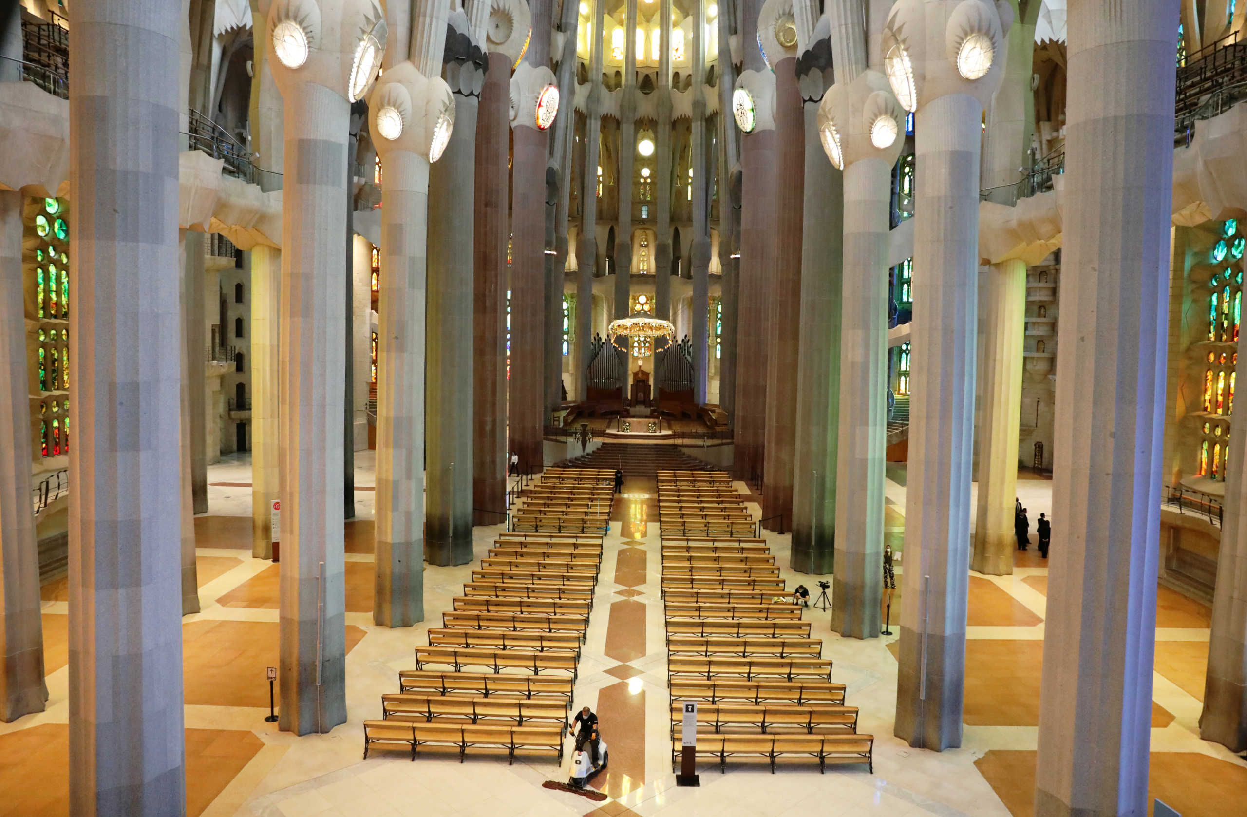 A man uses a machine as he cleans the Sagrada Familia basilica a day ahead of its reopening, after being closed for over three months due to the coronavirus disease (COVID-19) outbreak, in Barcelona, Spain July 3, 2020. REUTERS