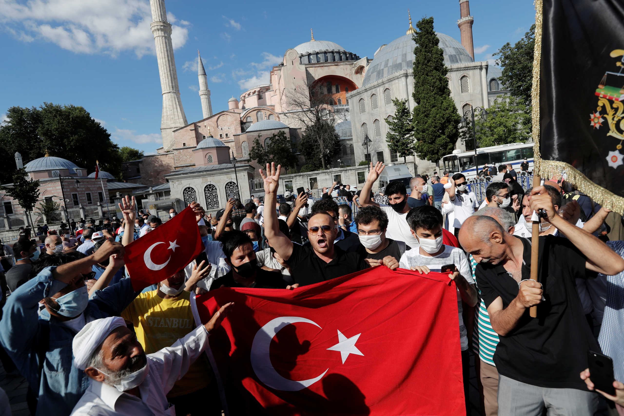 People gather in front of the Hagia Sophia or Ayasofya, after a court decision that paves the way for it to be converted from a museum back into a mosque, in Istanbul, Turkey, July 10, 2020. REUTERS