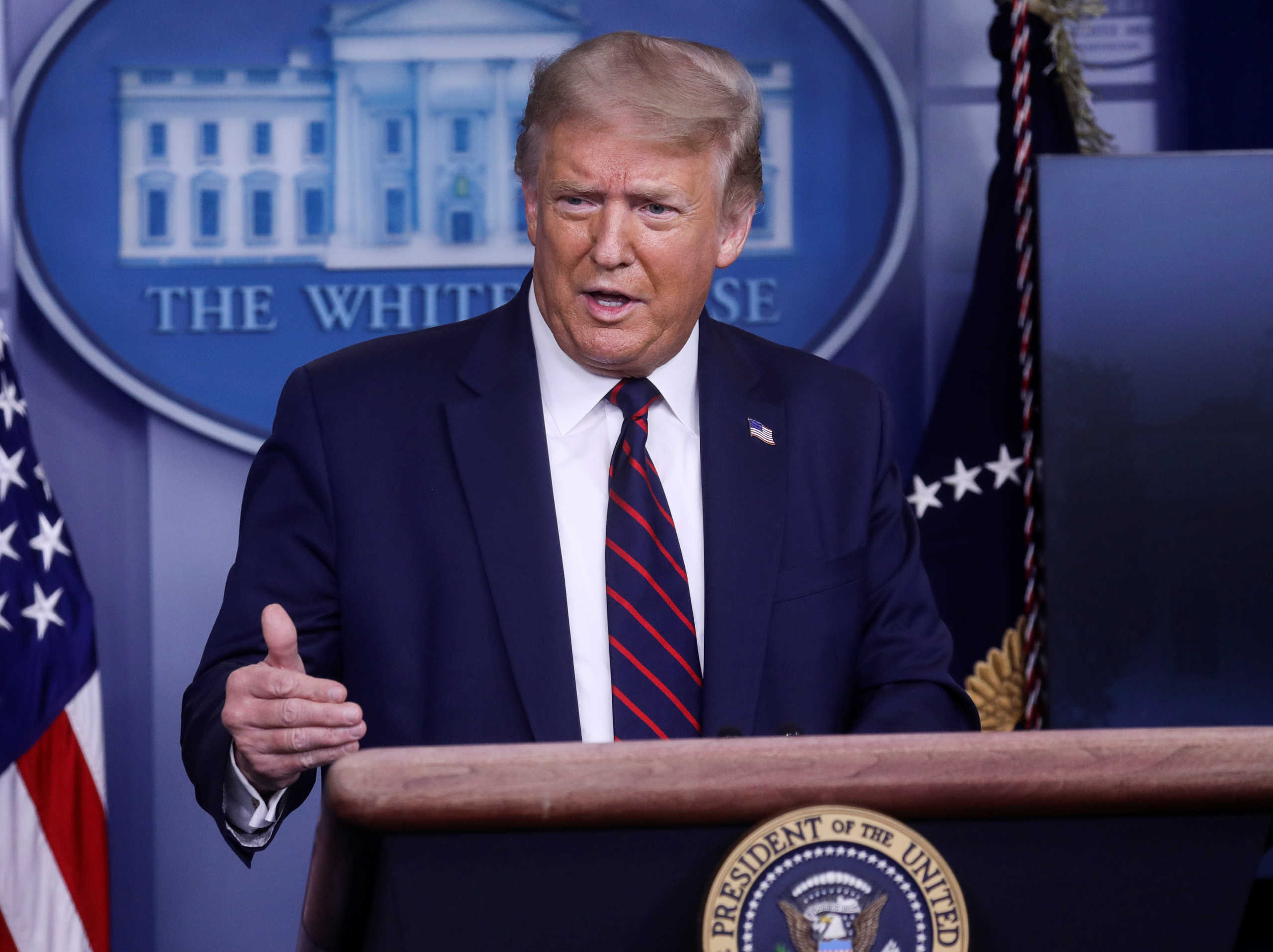 U.S. President Donald Trump answers questions during a coronavirus disease (COVID-19) response news briefing at the White House in Washington, U.S., July 21, 2020. REUTERS