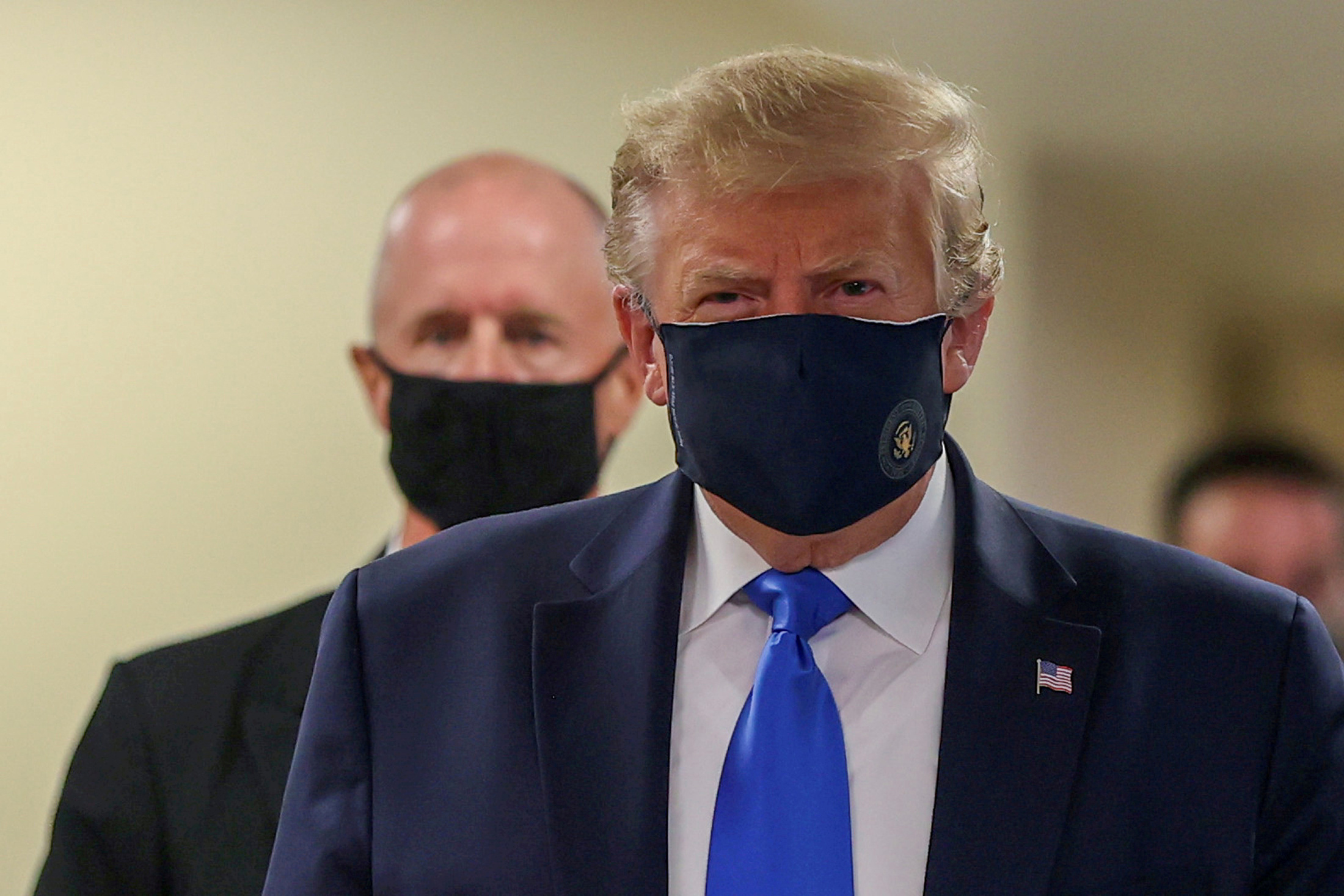FILE PHOTO: U.S. President Donald Trump wears a mask while visiting Walter Reed National Military Medical Center in Bethesda, Maryland, U.S., July 11, 2020. REUTERS