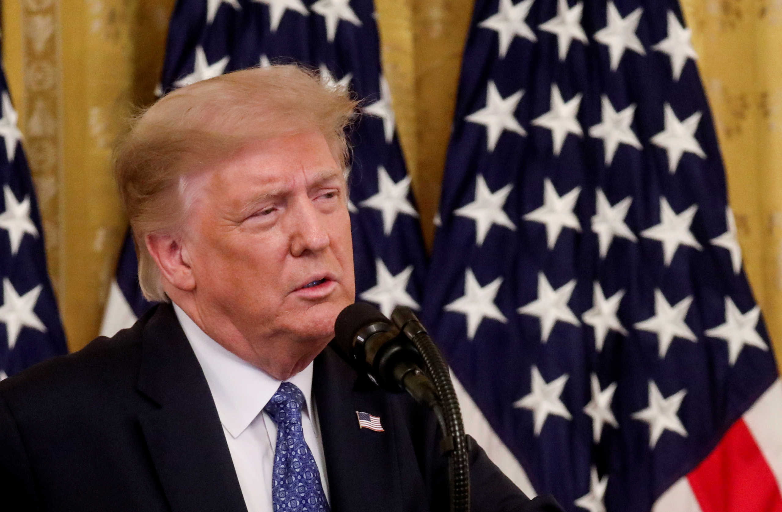 FILE PHOTO: U.S. President Donald Trump speaks about sending federal law enforcement agents to several U.S. cities to assist local police in combating what the Justice Department has described as a "surge" of violent crime, in the East Room at the White House in Washington, U.S., July 22, 2020. REUTERS