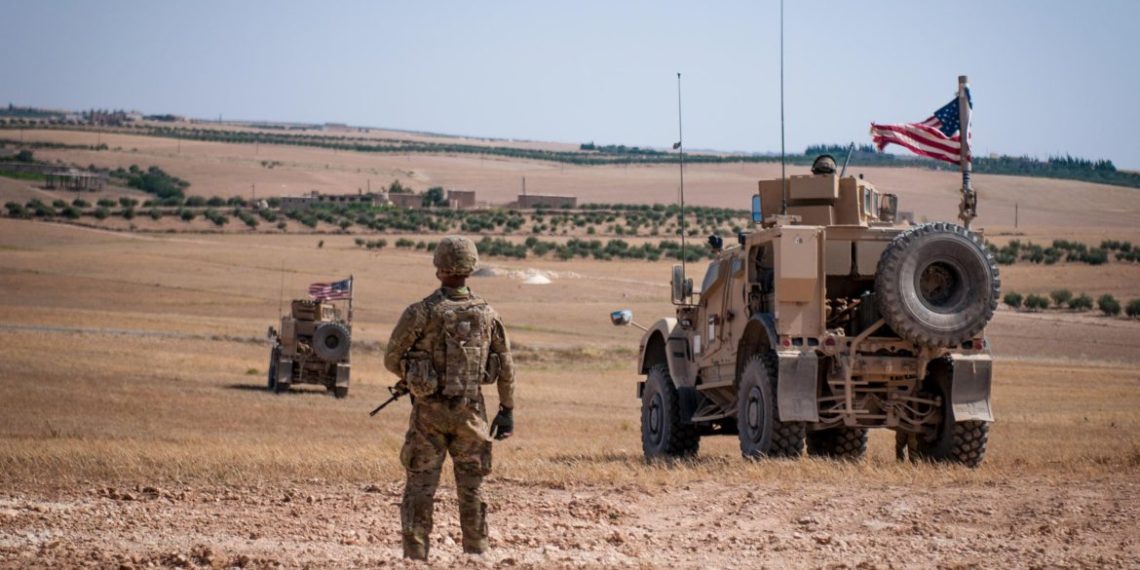 A U.S. Soldier stands guard during a security patrol outside Manbij, Syria, June 24, 2018. The patrols are done in coordination with Turkish military forces along the demarcation line outside Manbij to achieve safety and stability in the region. (U.S. Army photo by Staff Sgt. Timothy R. Koster)