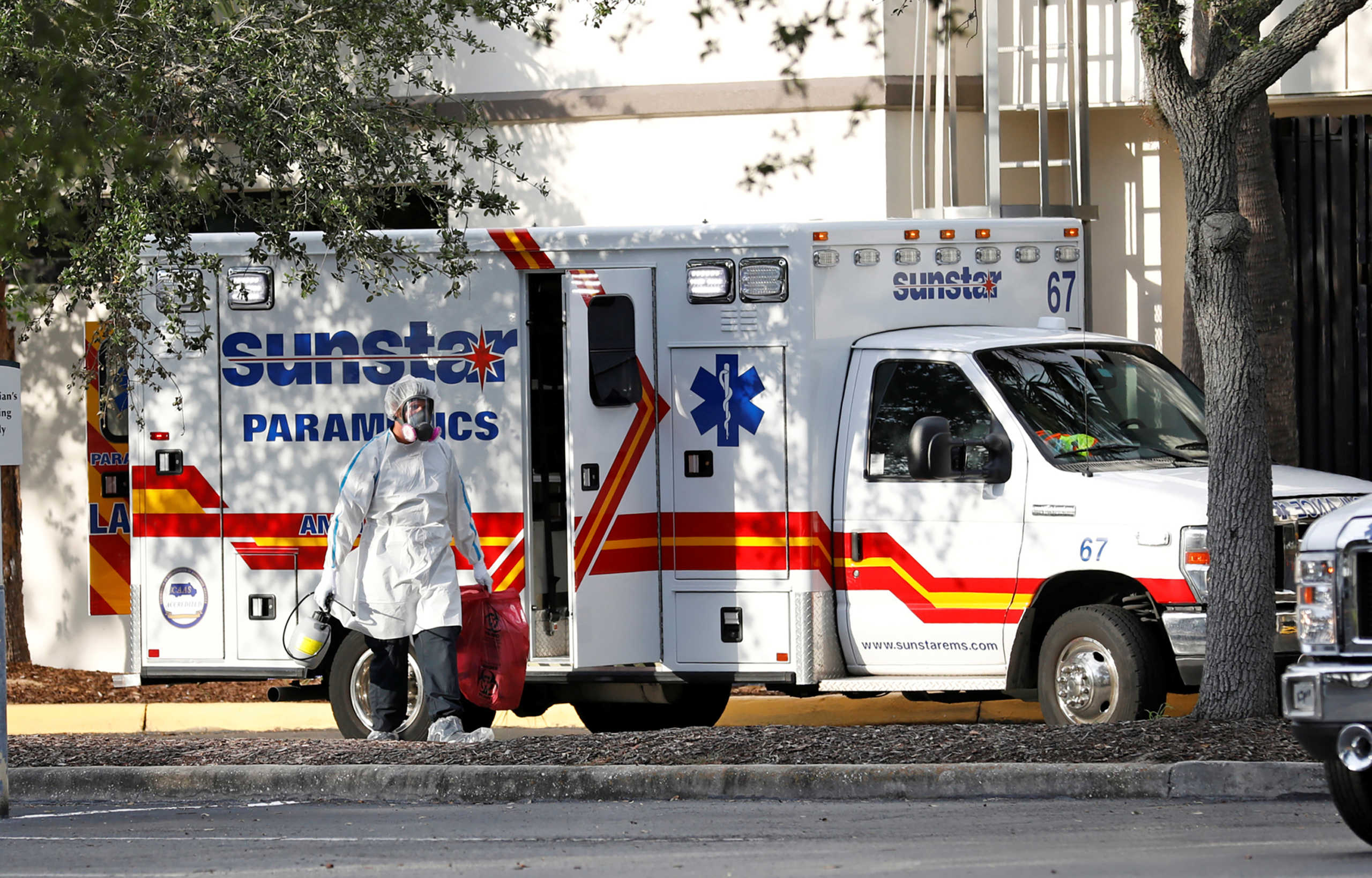 A paramedic dressed in personal protective equipment exits an ambulance at St. Petersburg General Hospital, where coronavirus disease (COVID-19) cases are being treated, in St. Petersburg, Florida, U.S. July 15, 2020. REUTERS