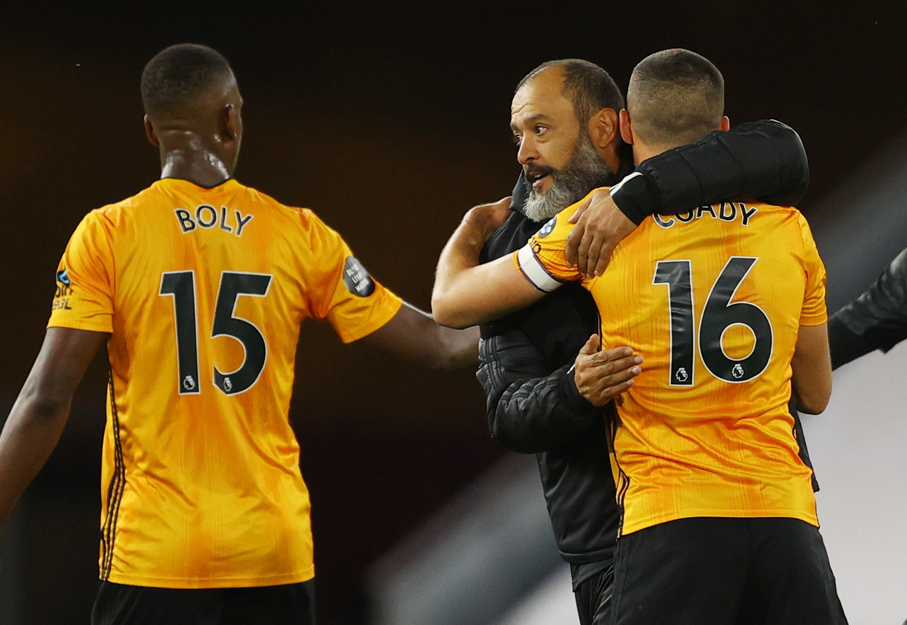 Soccer Football - Premier League - Wolverhampton Wanderers v Crystal Palace - Molineux Stadium, Wolverhampton, Britain - July 20, 2020 Wolverhampton Wanderers manager Nuno Espirito Santo celebrates with Conor Coady and Willy Boly after the match, as play resumes behind closed doors following the outbreak of the coronavirus disease (COVID-19) Pool via REUTERS