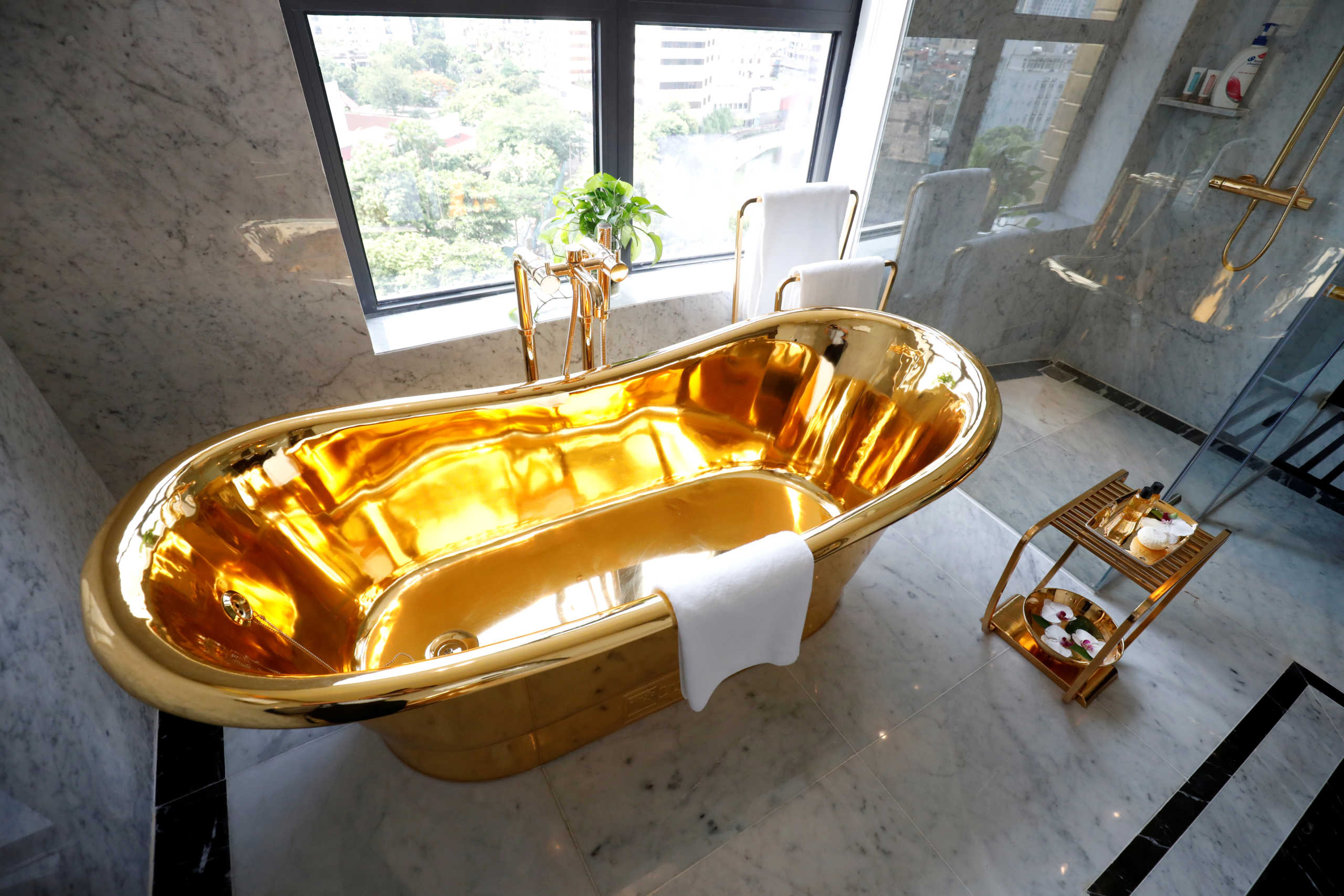 FILE PHOTO: A gold-plated bathtub is seen in the newly inaugurated Dolce Hanoi Golden Lake luxury hotel, after the government eased a nationwide lockdown following the global outbreak of the coronavirus disease (COVID-19), in Hanoi, Vietnam July 2, 2020. REUTERS