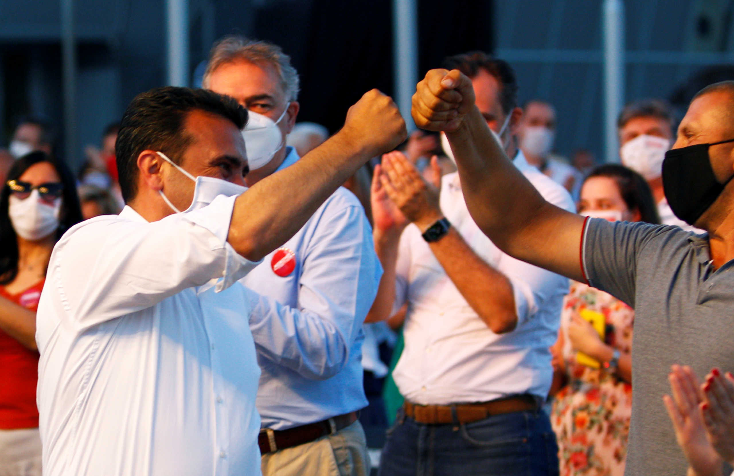 Zoran Zaev, leader of the ruling SDSM party, gestures during a gathering with supporters after planned snap elections in April had to be postponed due to the coronavirus disease (COVID-19) outbreak, in Skopje, North Macedonia July 10, 2020. REUTERS
