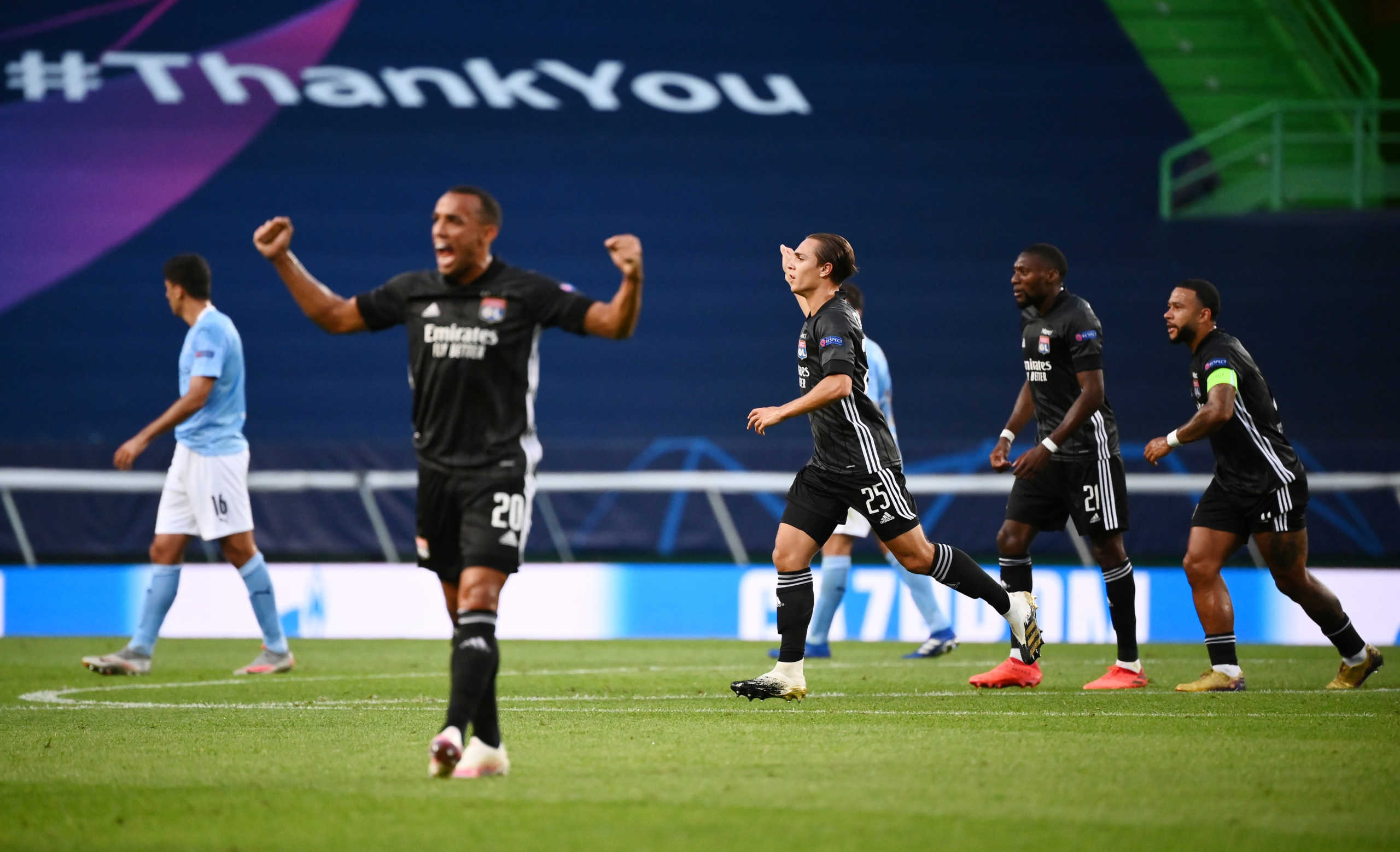 Soccer Football - Champions League Quarter Final - Manchester City v Olympique Lyonnais - Jose Alvalade Stadium, Lisbon, Portugal - August 15, 2020 Olympique Lyonnais players celebrate the Maxwel Cornet's goal and their first, as play resumes behind closed doors following the outbreak of the coronavirus disease (COVID-19)  Franck Fife