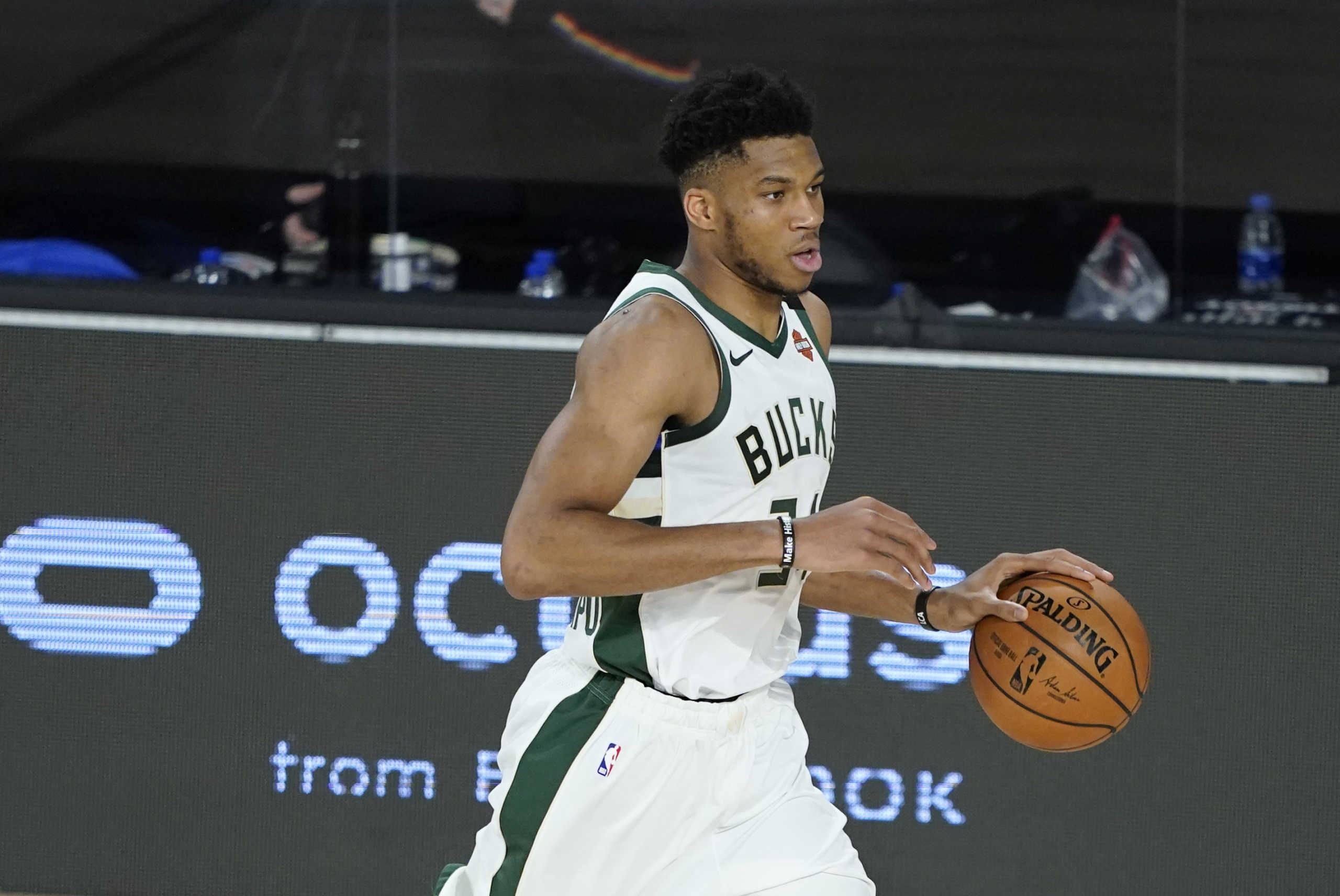 Aug 24, 2020; Lake Buena Vista, Florida, USA; Milwaukee Bucks' Giannis Antetokounmpo drives up court against the Orlando Magic during the second half in game four of the first round of the 2020 NBA Playoffs at The Field House. Mandatory Credit: Ashley Landis

 Monday, Aug. 24, 2020, in Lake Buena Vista, Fla. (AP Photo