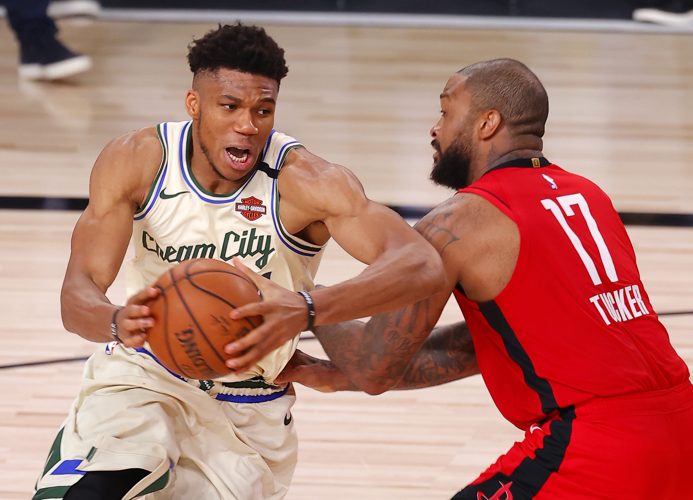 Aug 2, 2020; Lake Buena Vista, USA; Giannis Antetokounmpo #34 of the Milwaukee Bucks goes up for a shot against P.J. Tucker #17 of the Houston Rockets at The Arena at ESPN Wide World Of Sports Complex on August 02, 2020 in Lake Buena Vista, Florida. Mandatory Credit: Mike Ehrmann