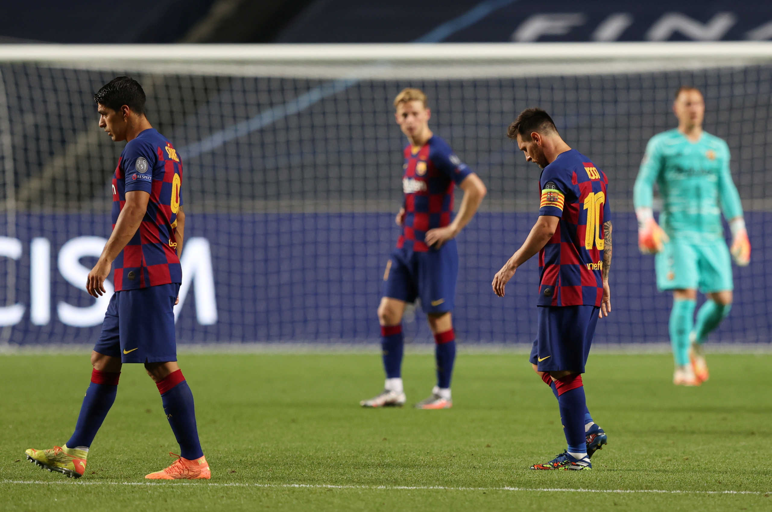 Soccer Football - Champions League - Quarter Final - FC Barcelona v Bayern Munich - Estadio da Luz, Lisbon, Portugal - August 14, 2020  Barcelona's Lionel Messi and Luis Suarez look dejected, as play resumes behind closed doors following the outbreak of the coronavirus disease (COVID-19)  REUTERS