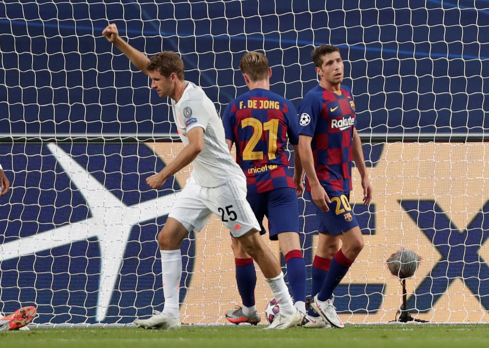 Soccer Football - Champions League - Quarter Final - FC Barcelona v Bayern Munich - Estadio da Luz, Lisbon, Portugal - August 14, 2020  Bayern Munich's Thomas Muller celebrates after Ivan Perisic scored their second goal, as play resumes behind closed doors following the outbreak of the coronavirus disease (COVID-19)  Manu Fernandez