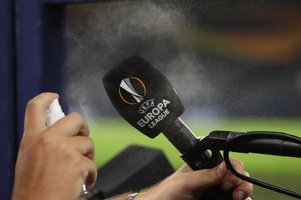 Soccer Football - Europa League - Quarter Final - Shakhtar Donetsk v Basel - Veltins-Arena, Gelsenkirchen, Germany - August 11, 2020 A microphone is disinfected after the match, as play resumes behind closed doors following the outbreak of the coronavirus disease (COVID-19) Pool via REUTERS