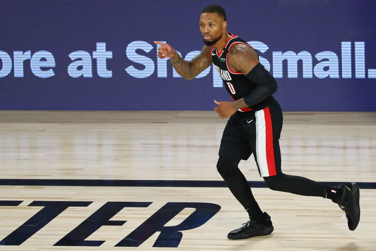 Aug 11, 2020; Lake Buena Vista, Florida, USA; Portland Trail Blazers guard Damian Lillard (0) reacts after making a three point basket against the Dallas Mavericks during the second half of a NBA game at The Field House. Mandatory Credit: Kim Klement-USA TODAY Sports