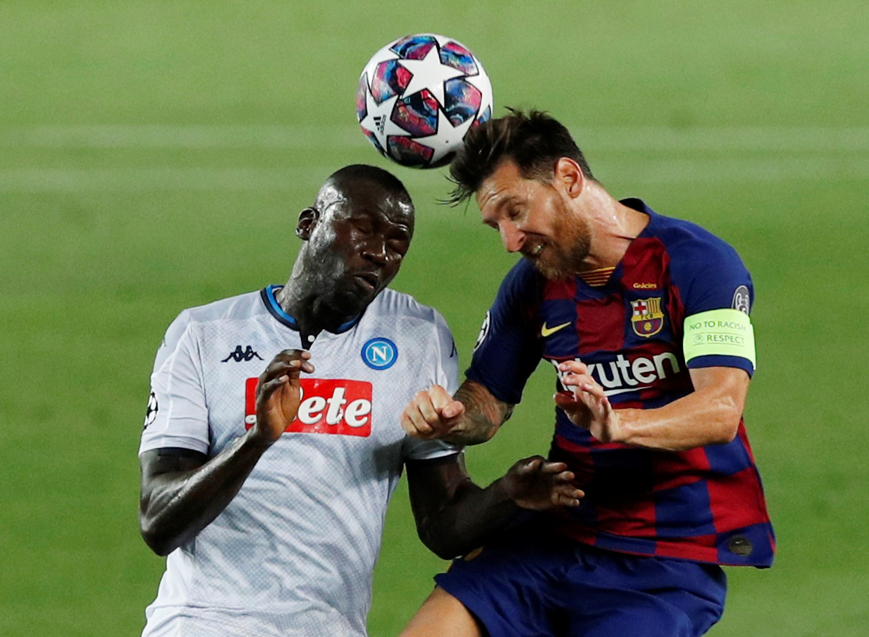 Soccer Football - Champions League - Round of 16 Second Leg - FC Barcelona v Napoli - Camp Nou, Barcelona, Spain - August 8, 2020  Barcelona's Lionel Messi in action with Napoli's Kalidou Koulibaly, as play resumes behind closed doors following the outbreak of the coronavirus disease (COVID-19)  REUTERS