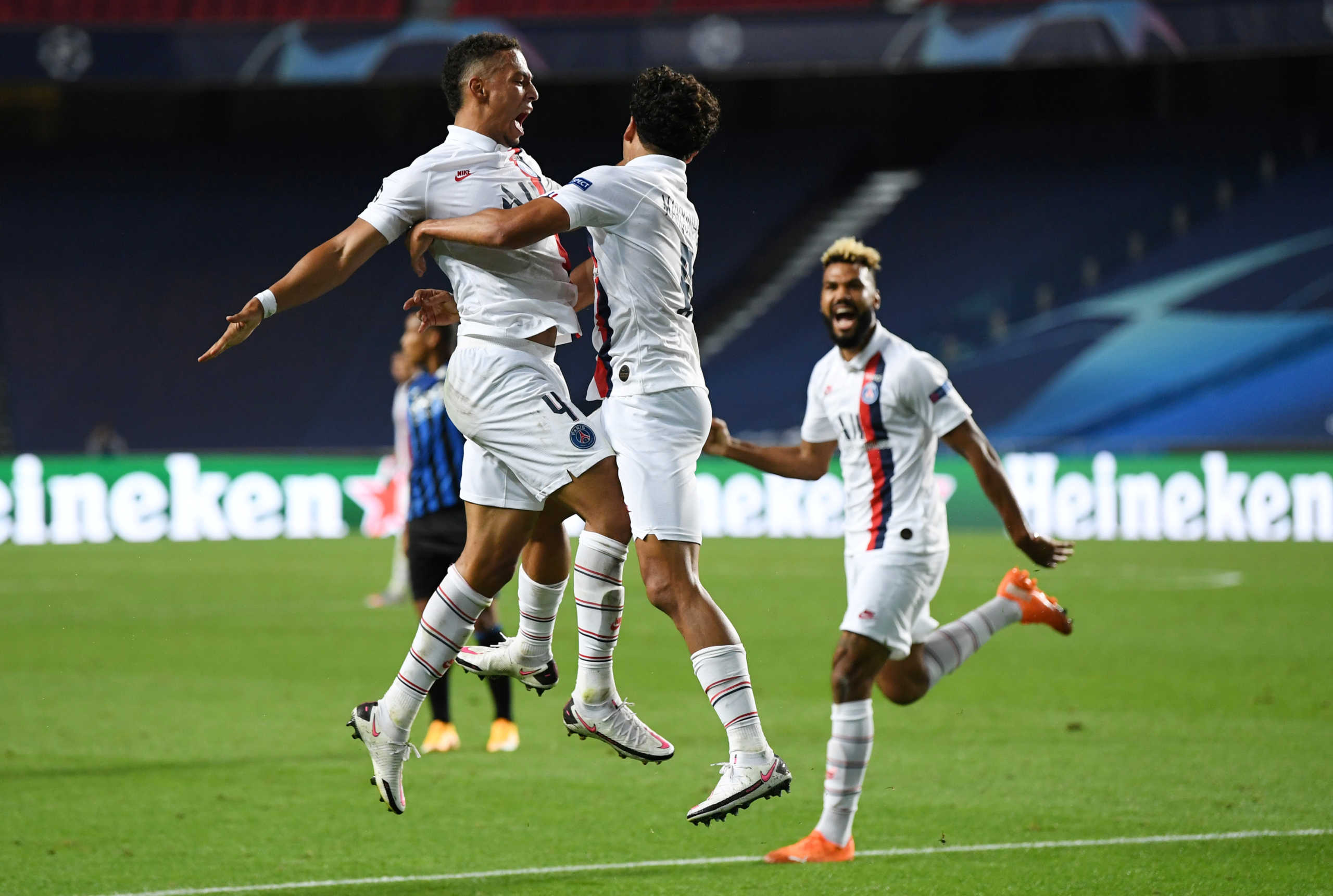 Soccer Football - Champions League - Quarter Final - Atalanta v Paris St Germain - Estadio da Luz, Lisbon, Portugal - August 12, 2020  Paris St Germain's Marquinhos celebrates scoring their first goal with Jan Kehrer, as play resumes behind closed doors following the outbreak of the coronavirus disease (COVID-19)  David Ramos