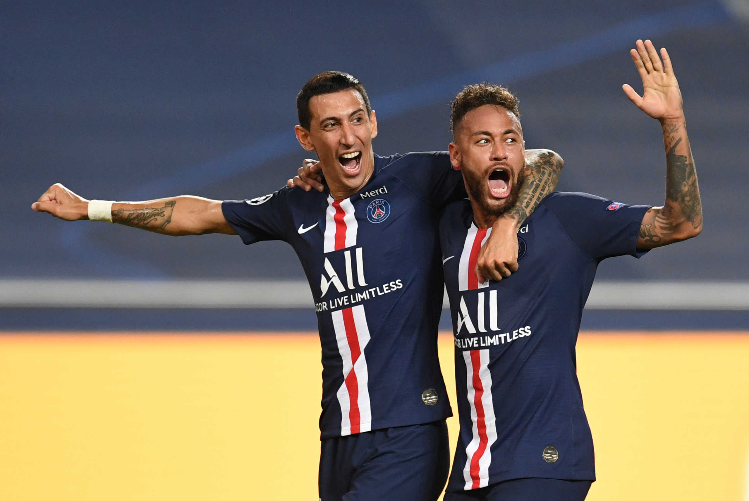 Soccer Football - Champions League - Semi Final - RB Leipzig v Paris St Germain - Estadio da Luz, Lisbon, Portugal - August 18, 2020  Paris St Germain's Angel Di Maria celebrates scoring their second goal with Neymar, as play resumes behind closed doors following the outbreak of the coronavirus disease (COVID-19)  David Ramos