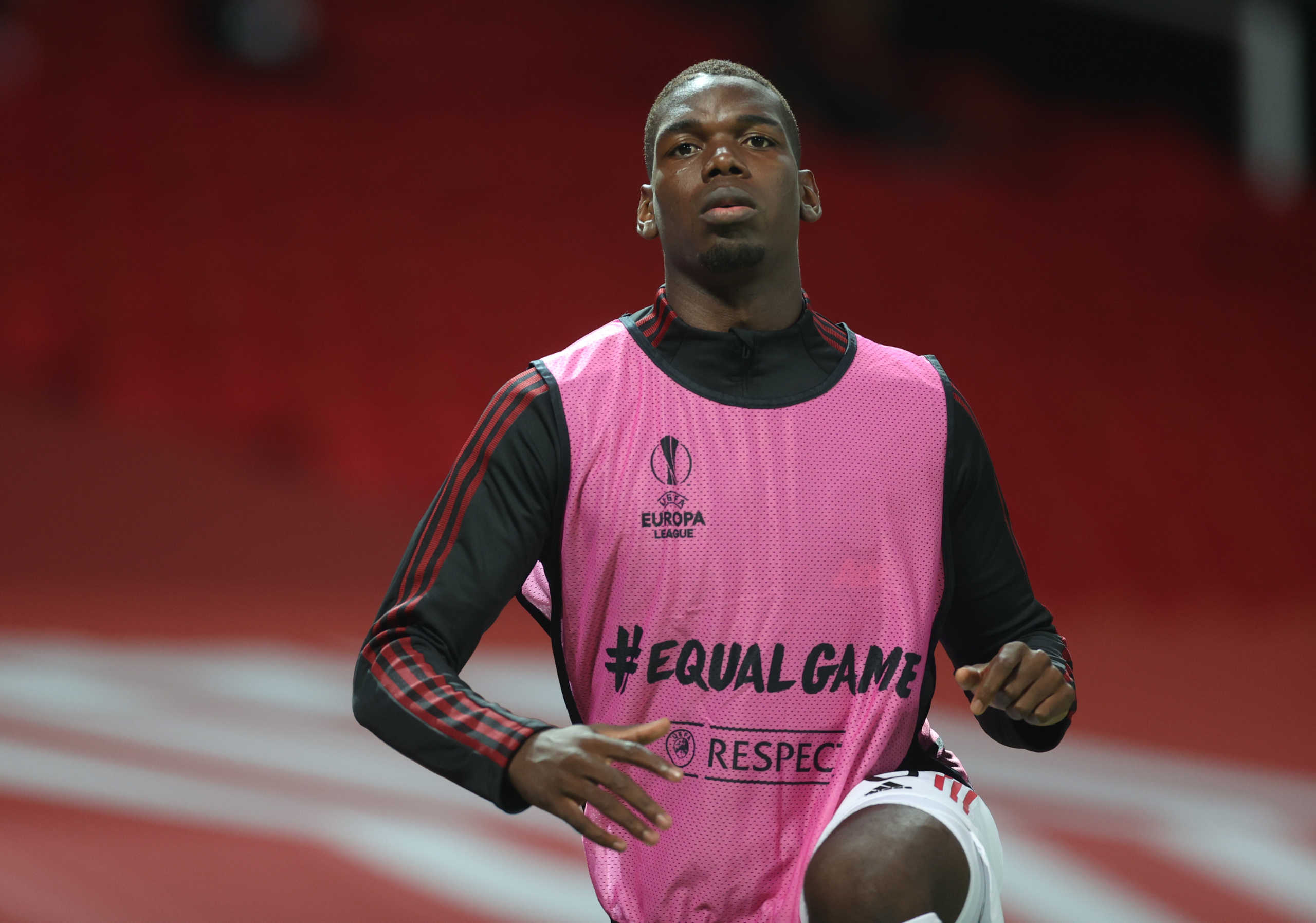 Soccer Football - Europa League - Round of 16 Second Leg - Manchester United v LASK Linz - Old Trafford, Manchester, Britain - August 5, 2020 Manchester United's Paul Pogba warms up, as play resumes behind closed doors following the outbreak of the coronavirus disease (COVID-19) REUTERS