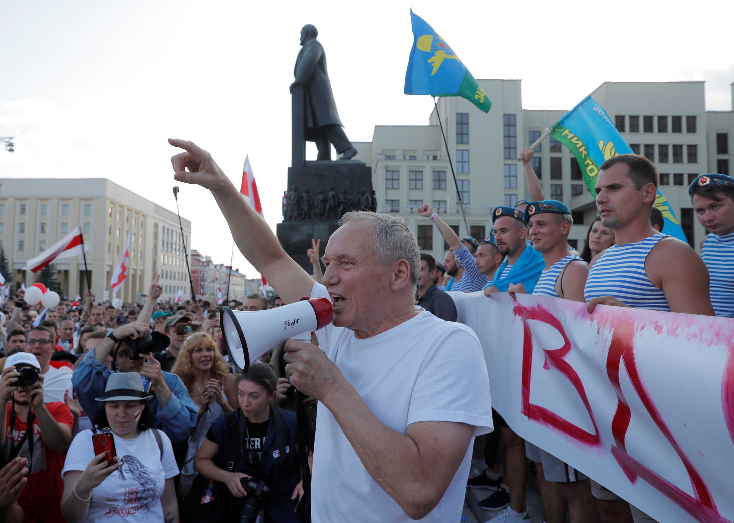 Belarusian opposition figure Vladimir Neklyayev addresses demonstrators during a protest against the presidential election results demanding the resignation of Belarusian President Alexander Lukashenko and the release of political prisoners, near the Government House in Independence Square in Minsk, Belarus August 16, 2020. REUTERS