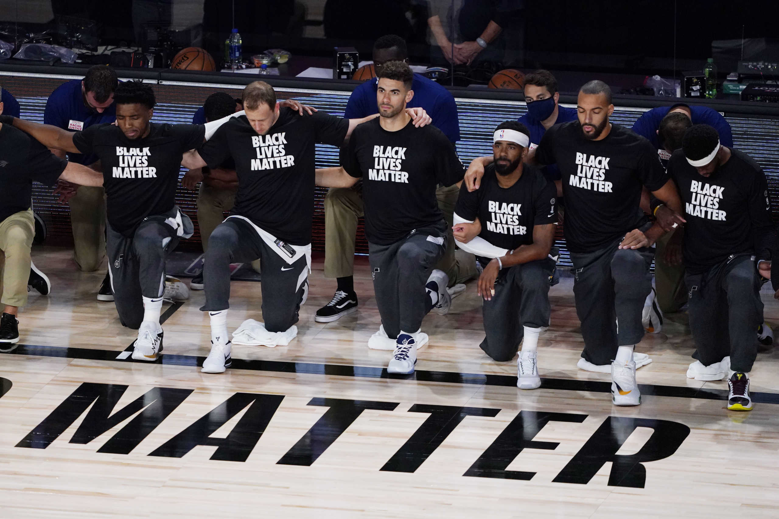 Aug 1, 2020; Lake Buena Vista, FL, USA; Players kneel before an NBA basketball game between the Utah Jazz and Oklahoma City Thunder, Saturday, Aug. 1, 2020, in Lake Buena Vista, Fla.  Mandatory Credit: Ashley Landis