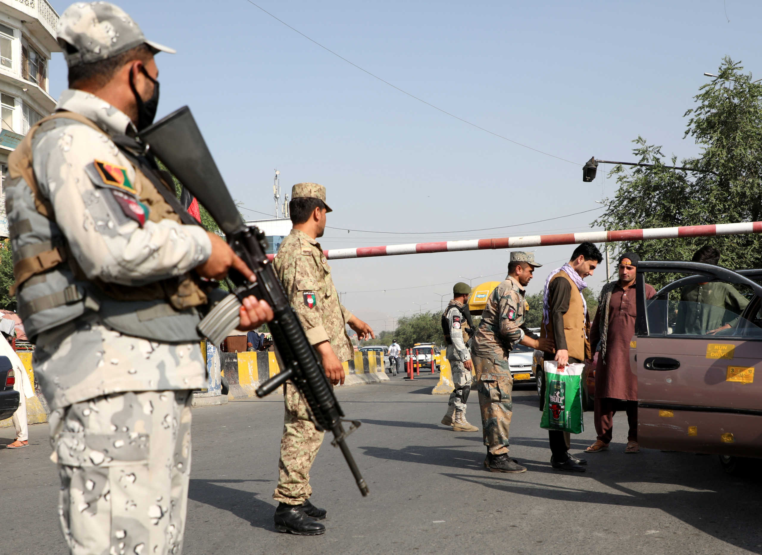 Afghan policemen stand guard at a check point in Kabul, Afghanistan August 7, 2020. REUTERS